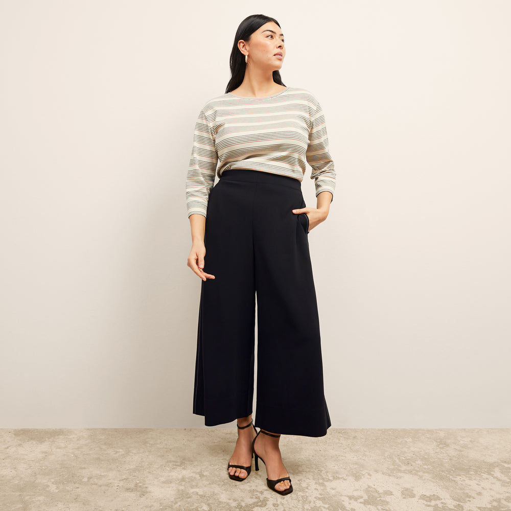 front image of a woman wearing the owen t-shirt in signature stripe