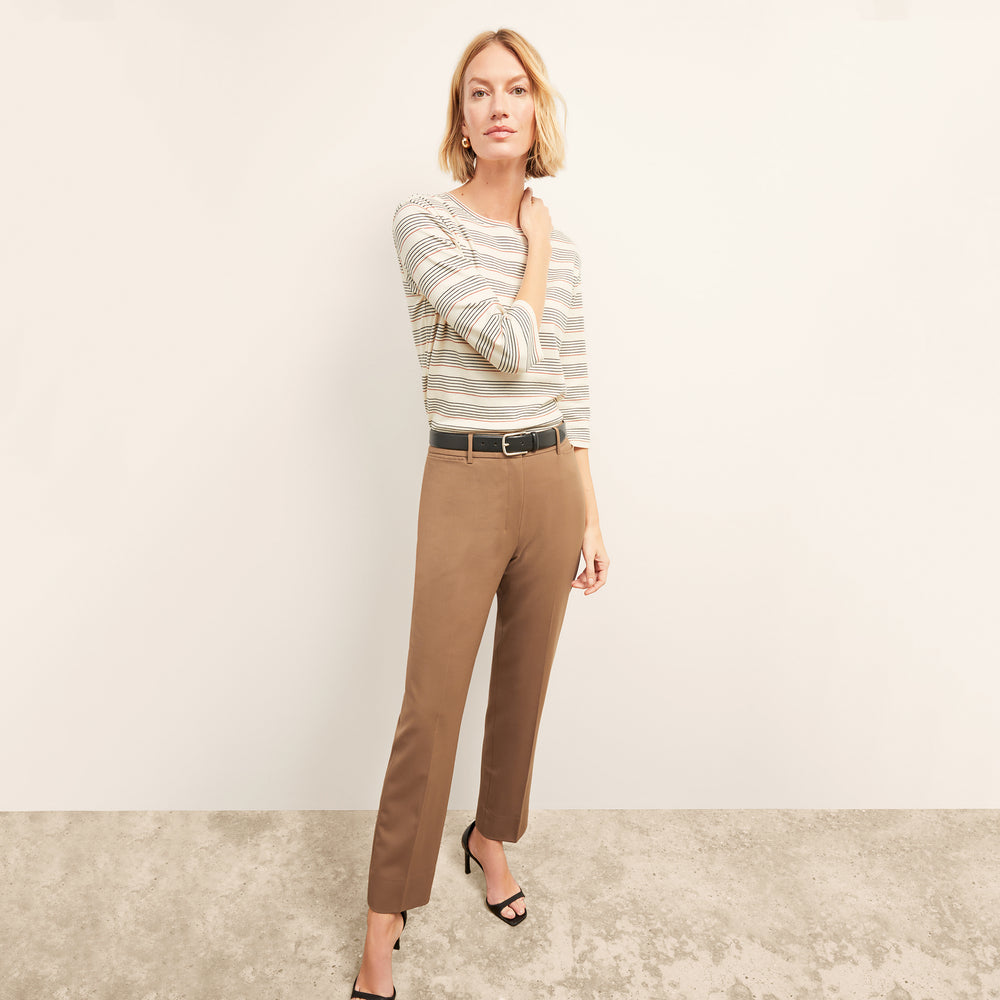 front image of a woman wearing the owen t-shirt in signature stripe