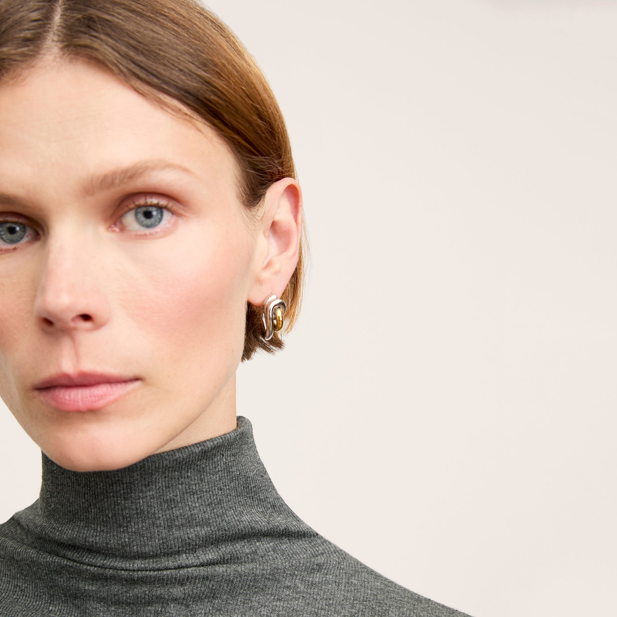 Detail image of a woman wearing the Axam Turtleneck in Charcoal