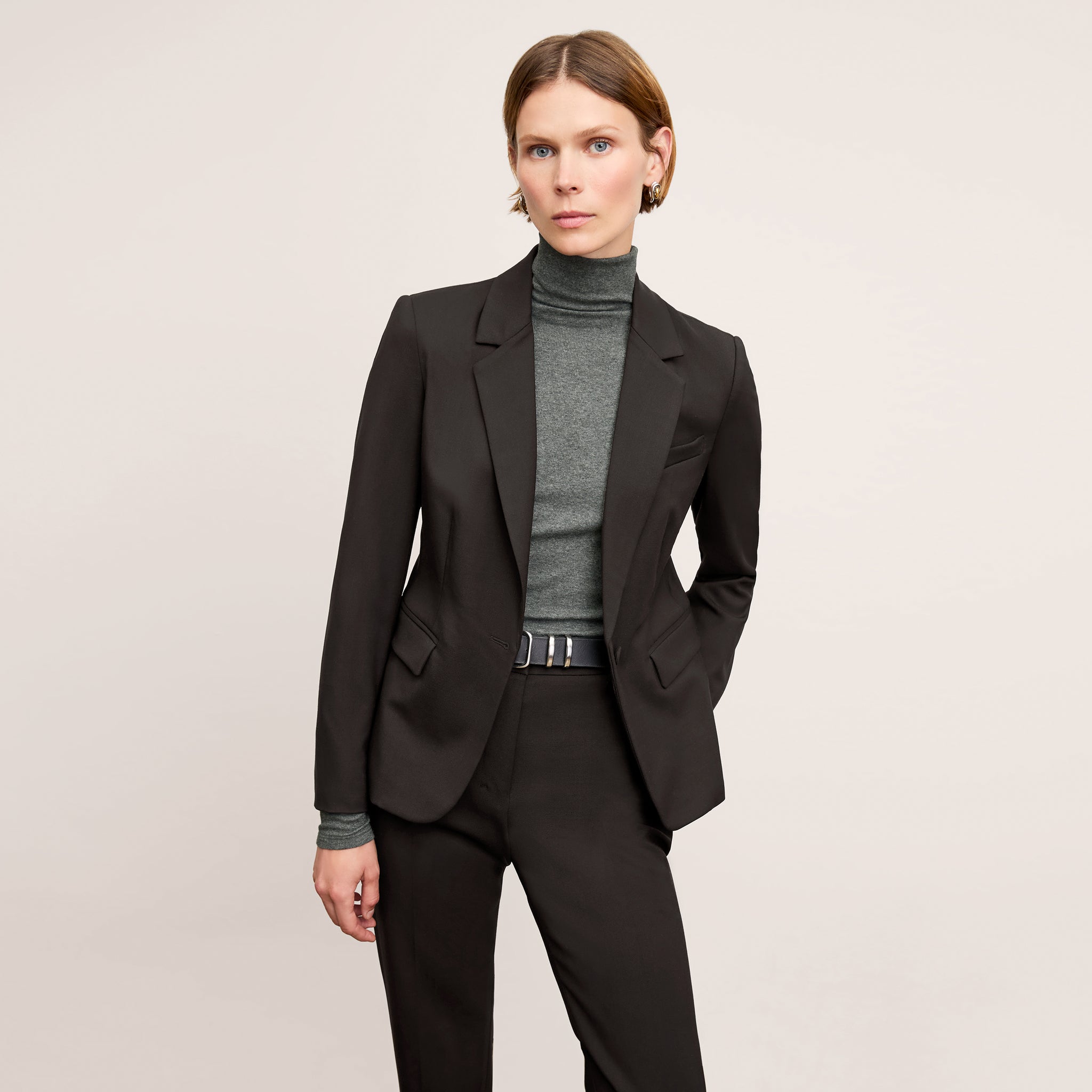 Front image of a woman wearing the Axam Turtleneck in Charcoal