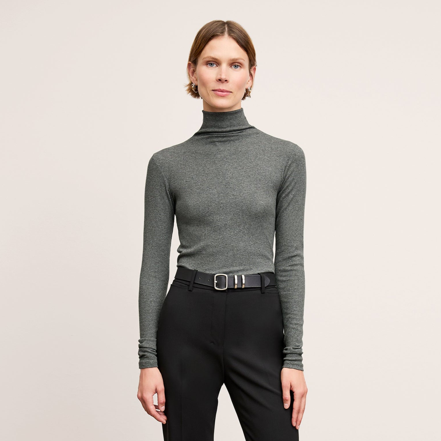 Front image of a woman wearing the Axam Turtleneck in Charcoal 