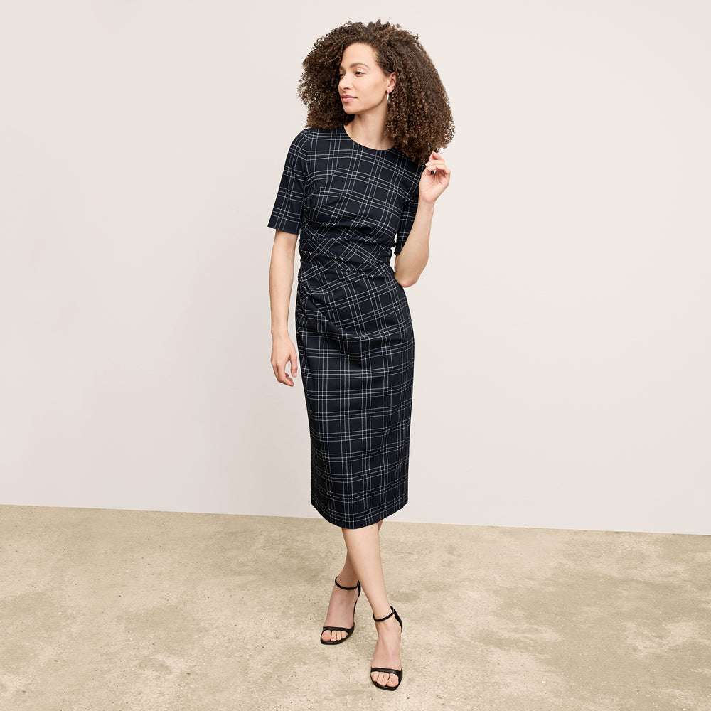 front image of a woman wearing the ciela dress in black/white