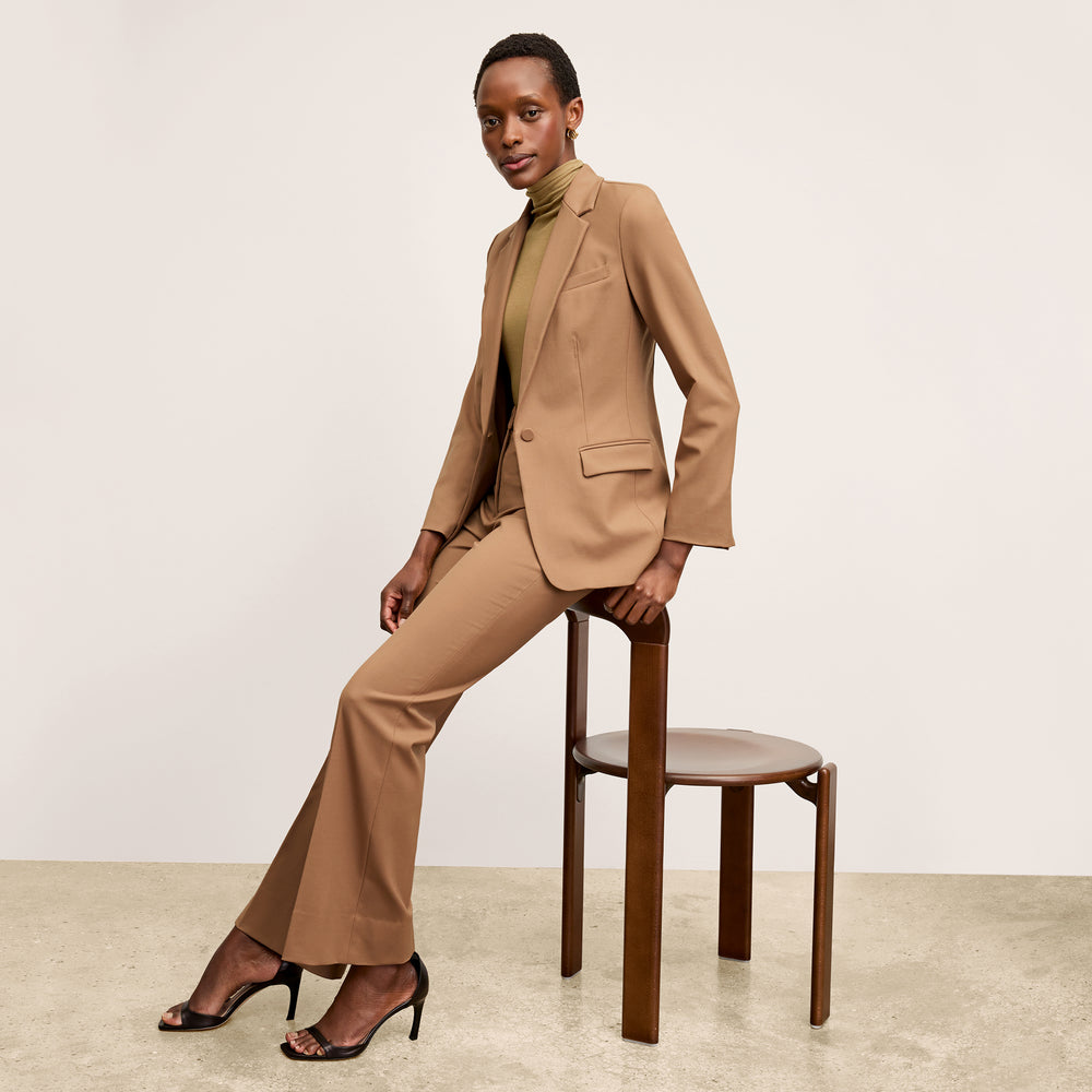 Front image of a woman standing wearing the Horton Pant-Washable Wool Twill in camel