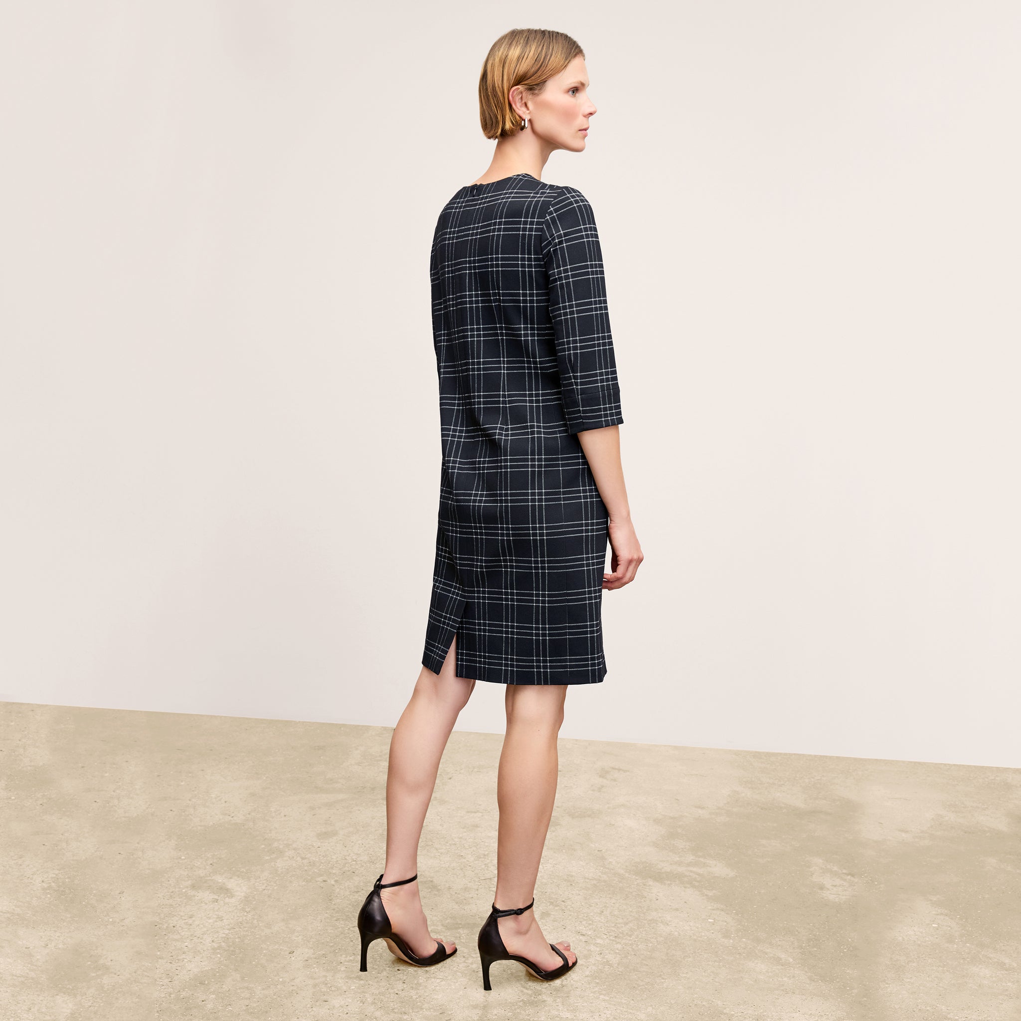back image of a woman wearing the lancia dress in black/white