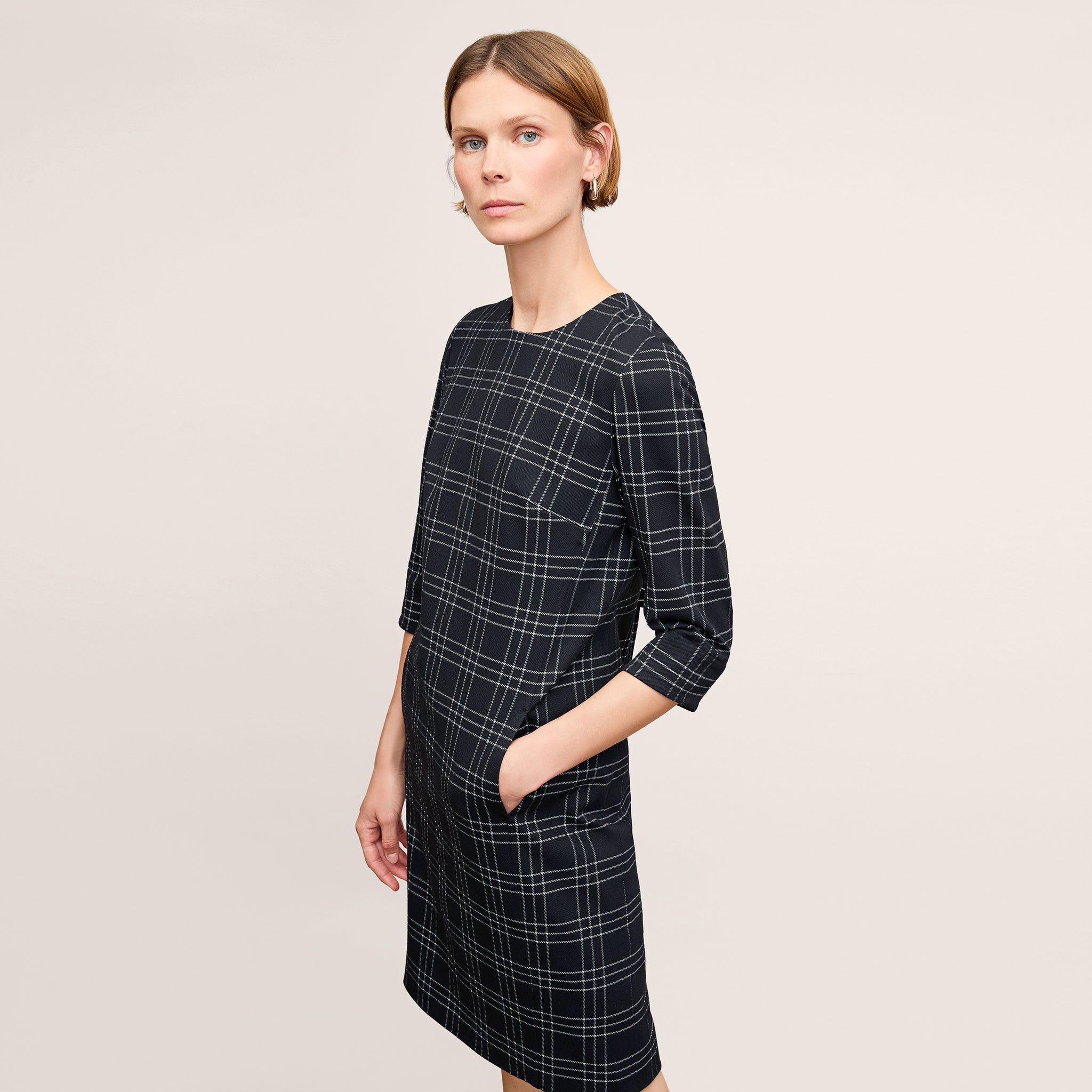 front image of a woman wearing the lancia dress in black/white 