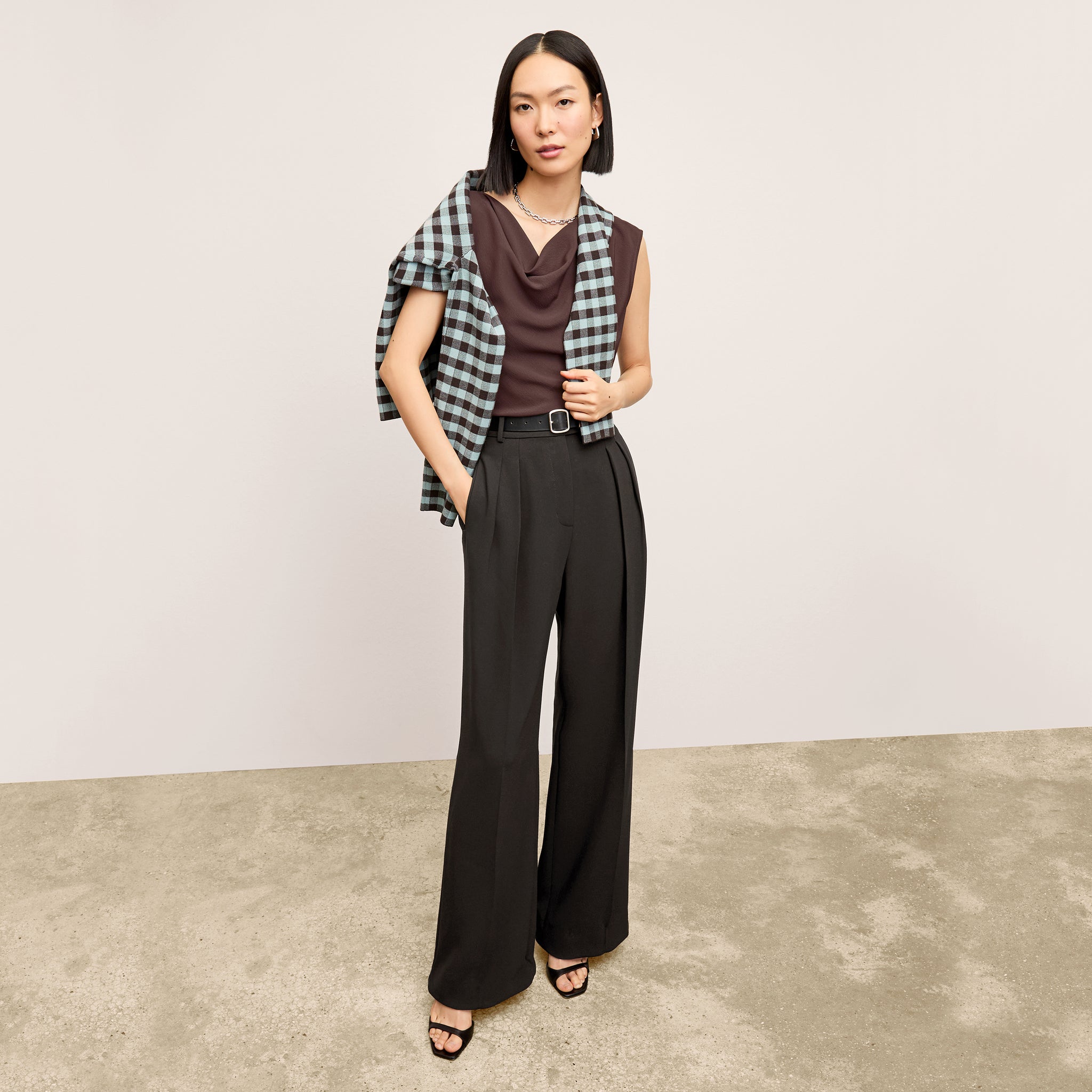 front image of a woman wearing the nora top in espresso