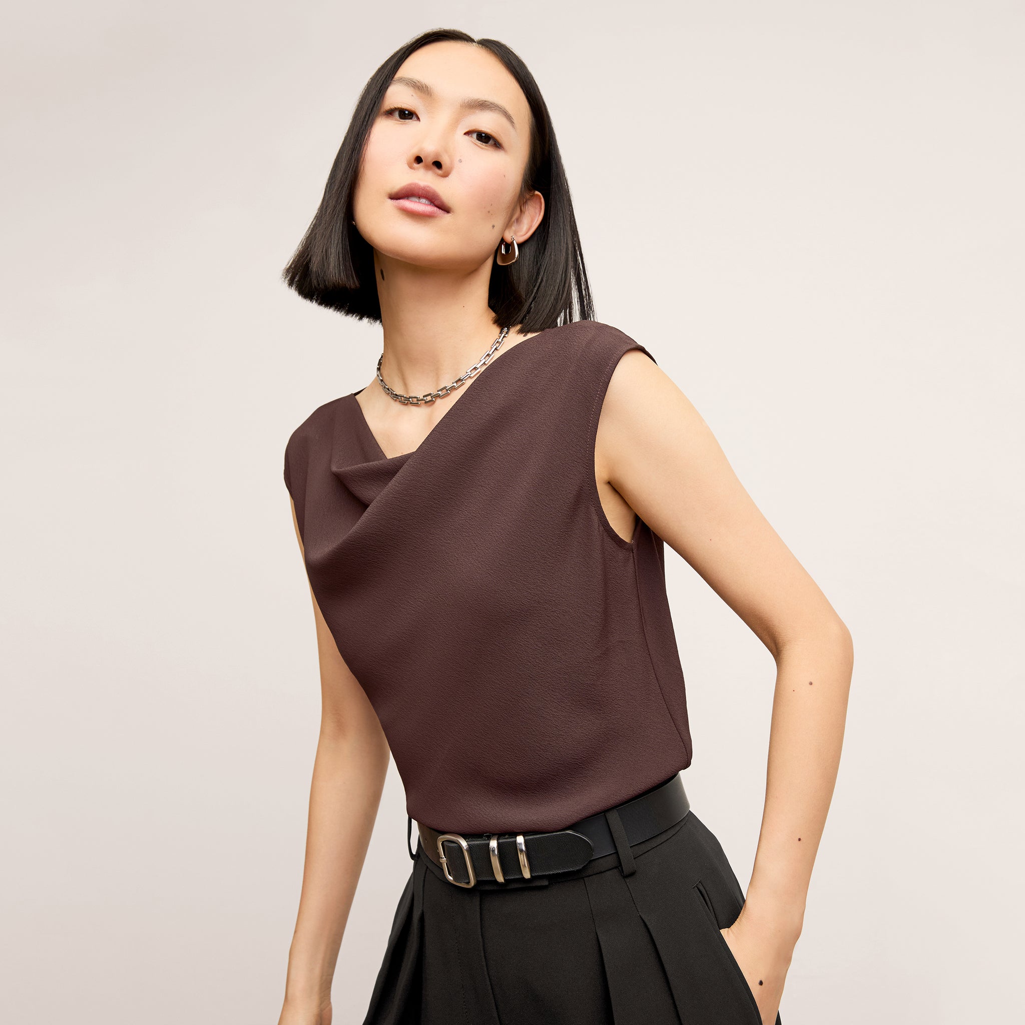 front image of a woman wearing the nora top in espresso 