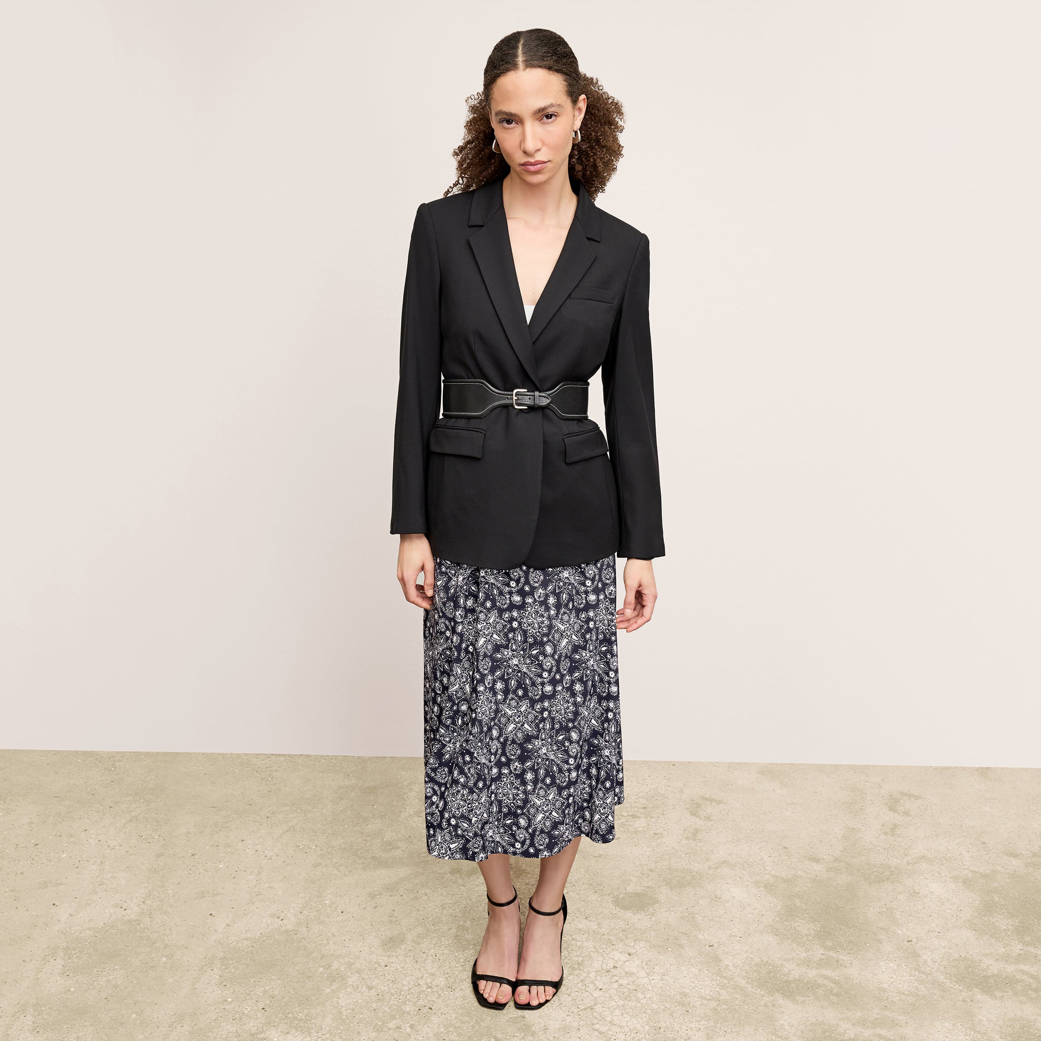 Front image of a woman wearing the Yiyan Blazer in Black
