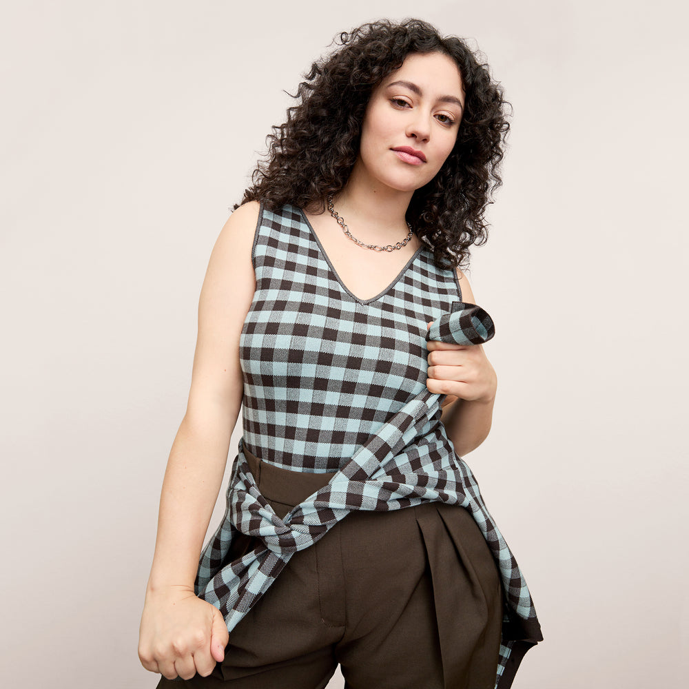 front image of a woman wearing the peggy top in picnic check