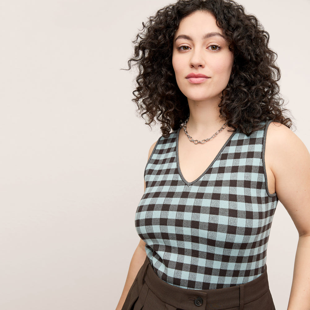 front image of a woman wearing the peggy top in picnic check
