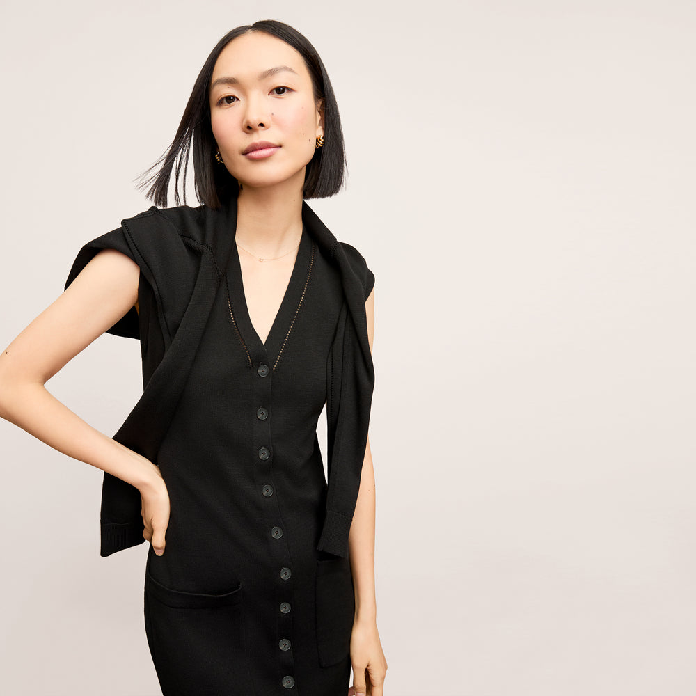front image of a woman wearing the toula dress in black