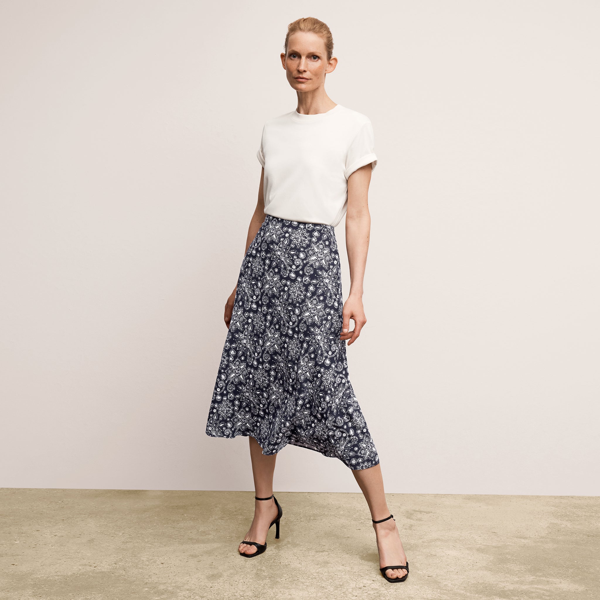 Front image of a woman wearing the leslie top in compact cotton in ivory