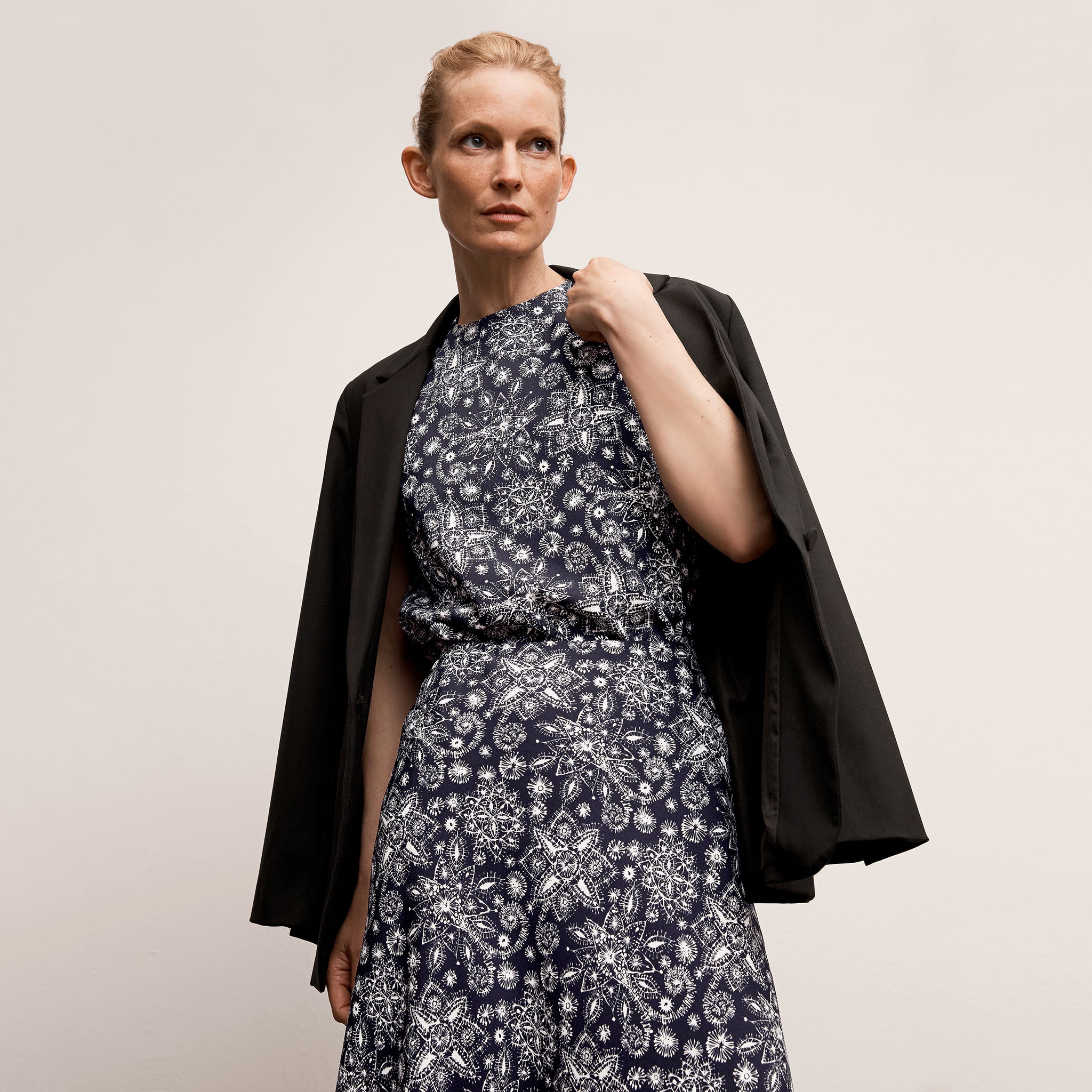 Front image of a woman wearing the Yiyan Blazer in Black