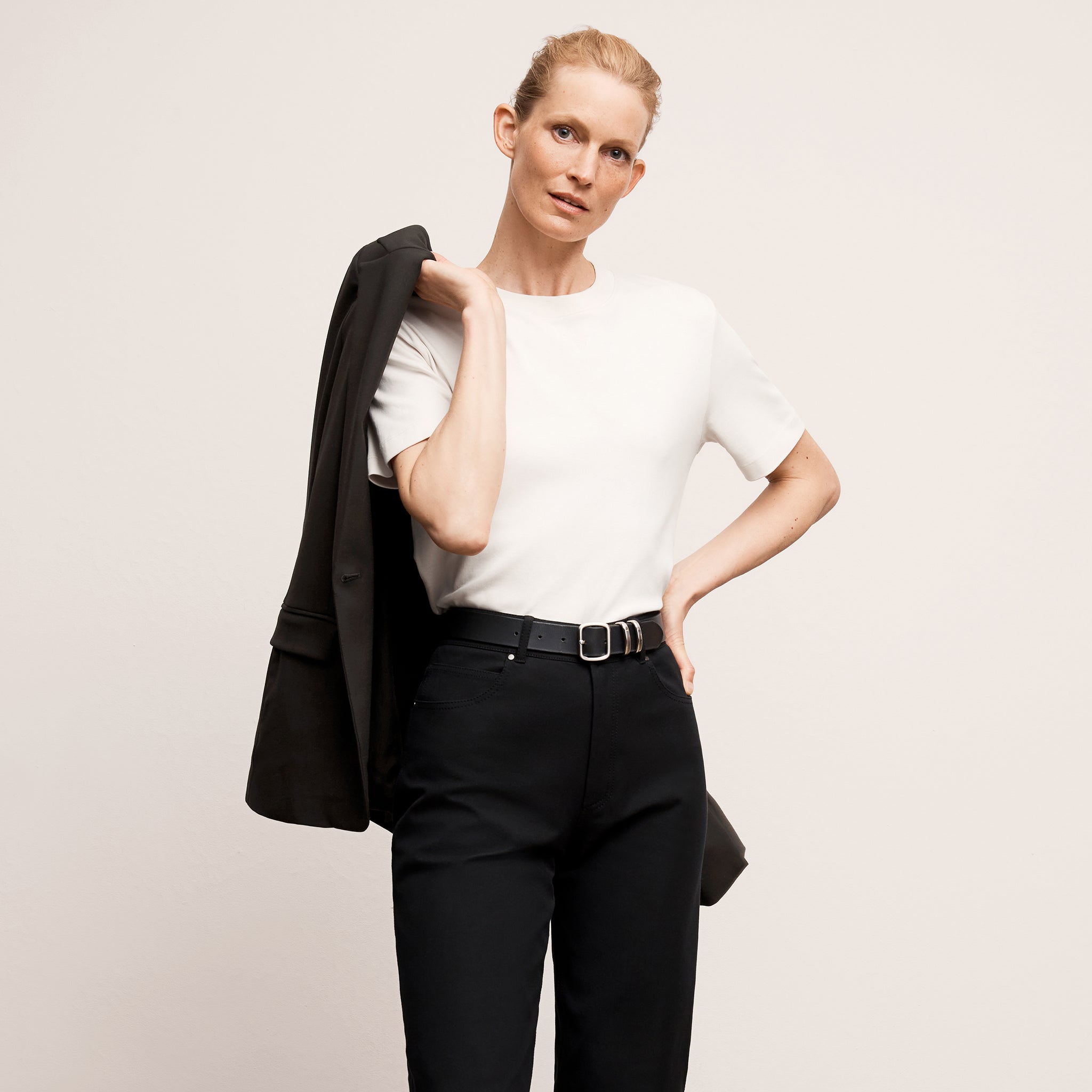Front image of a woman wearing the leslie top in compact cotton in ivory