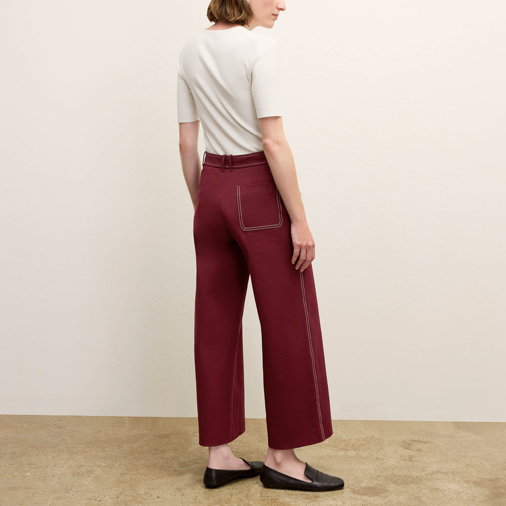 back image of a woman wearing the abby pant in berry jam