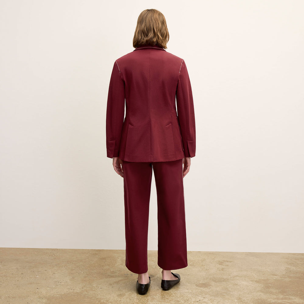 back image of a woman wearing the grenville jacket in berry jam