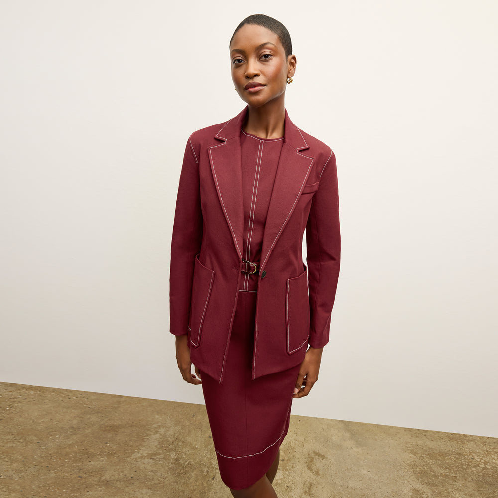 front image of a woman wearing the maude dress in berry jam