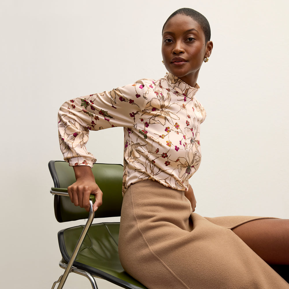 front image of a woman wearing the sohee top in botanical print