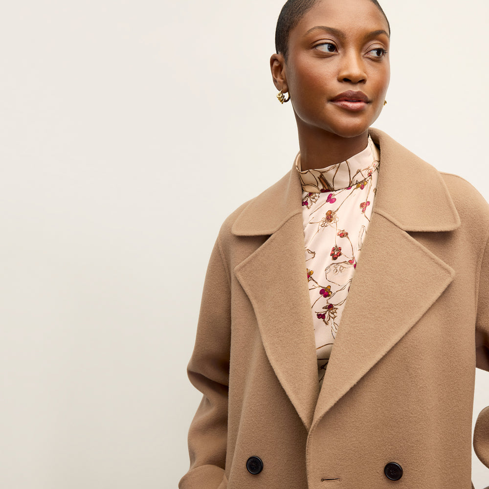 front image of a woman wearing the viola coat in camel