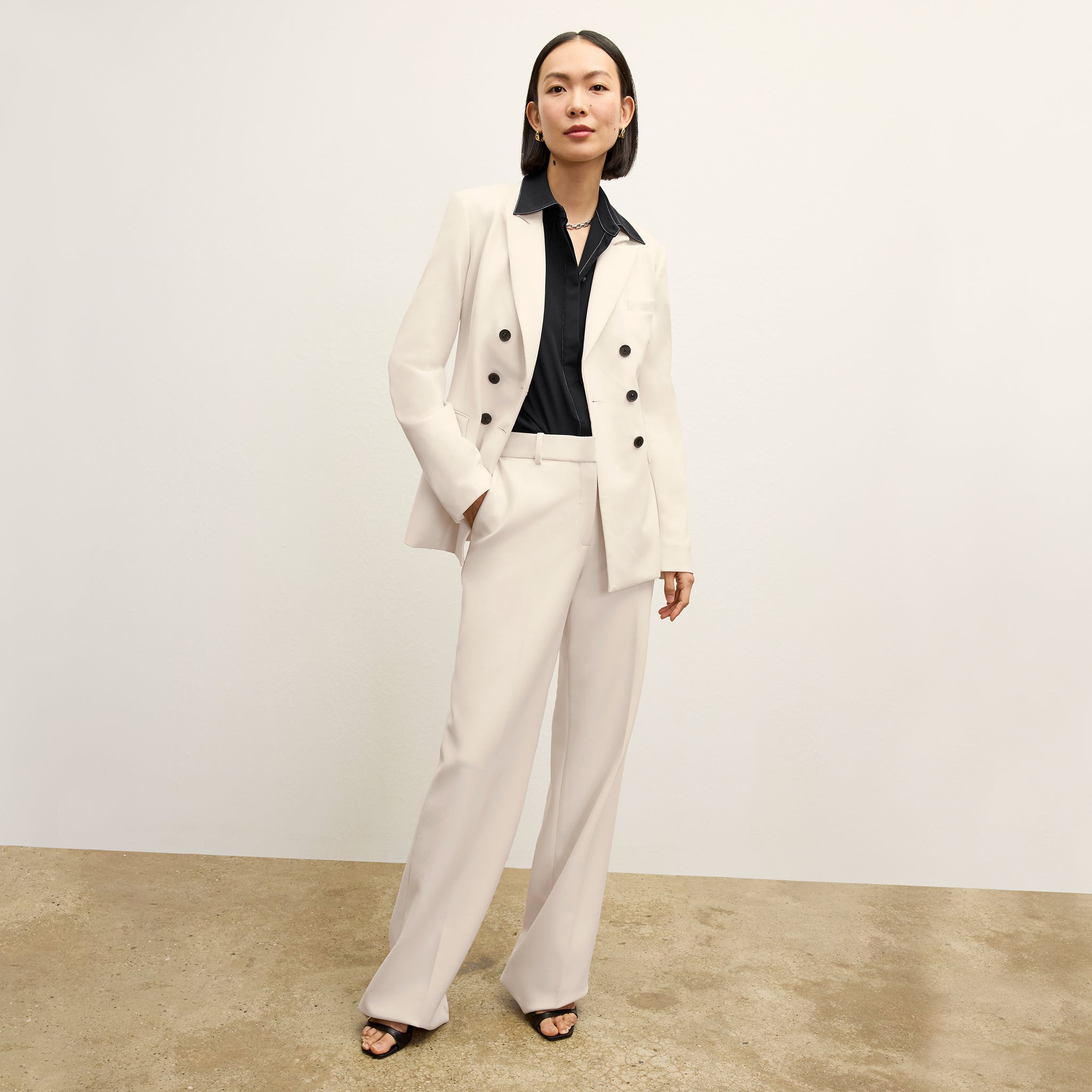 front image of a woman wearing the kati jacket in ivory