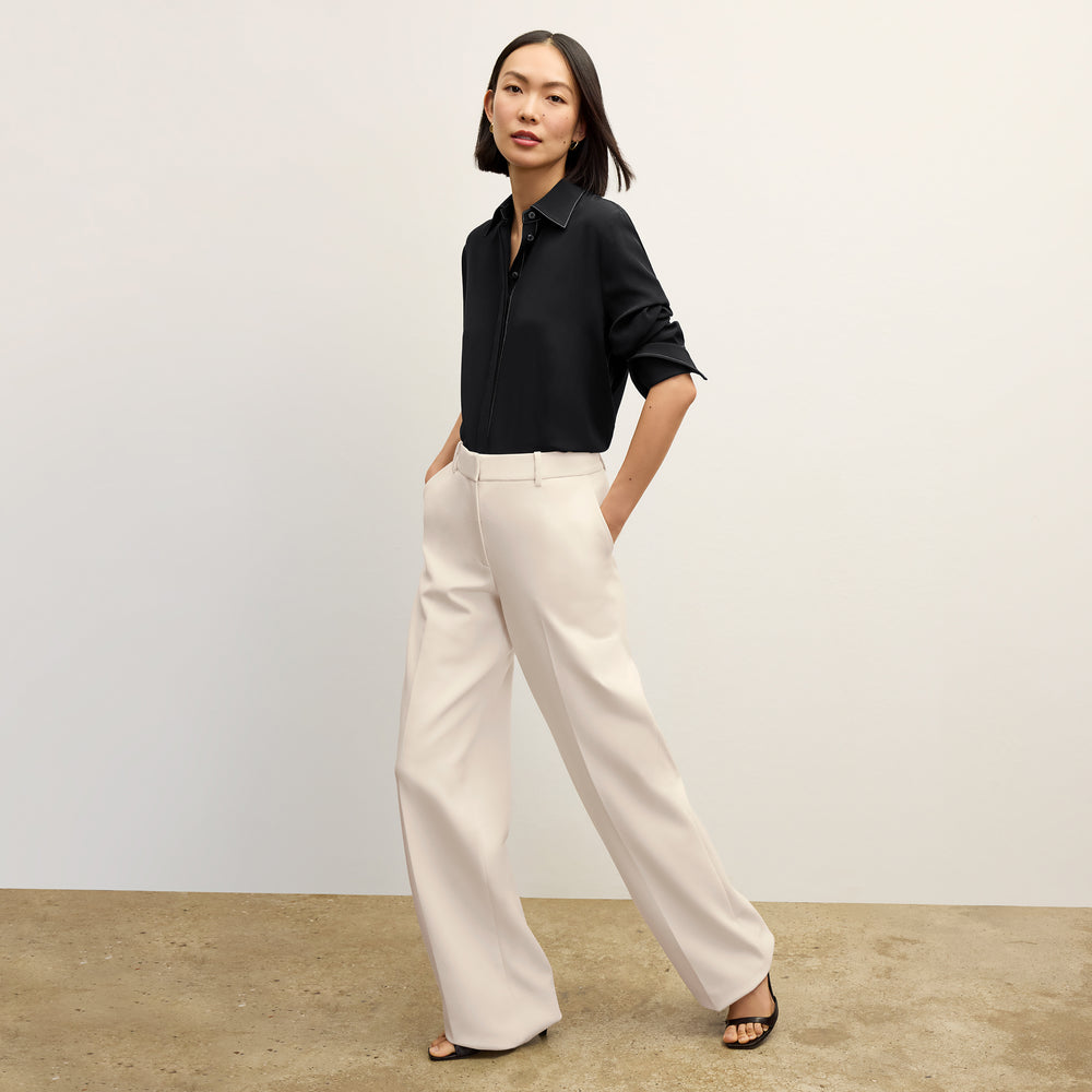 front image of a woman wearing the tinsley pant ivory