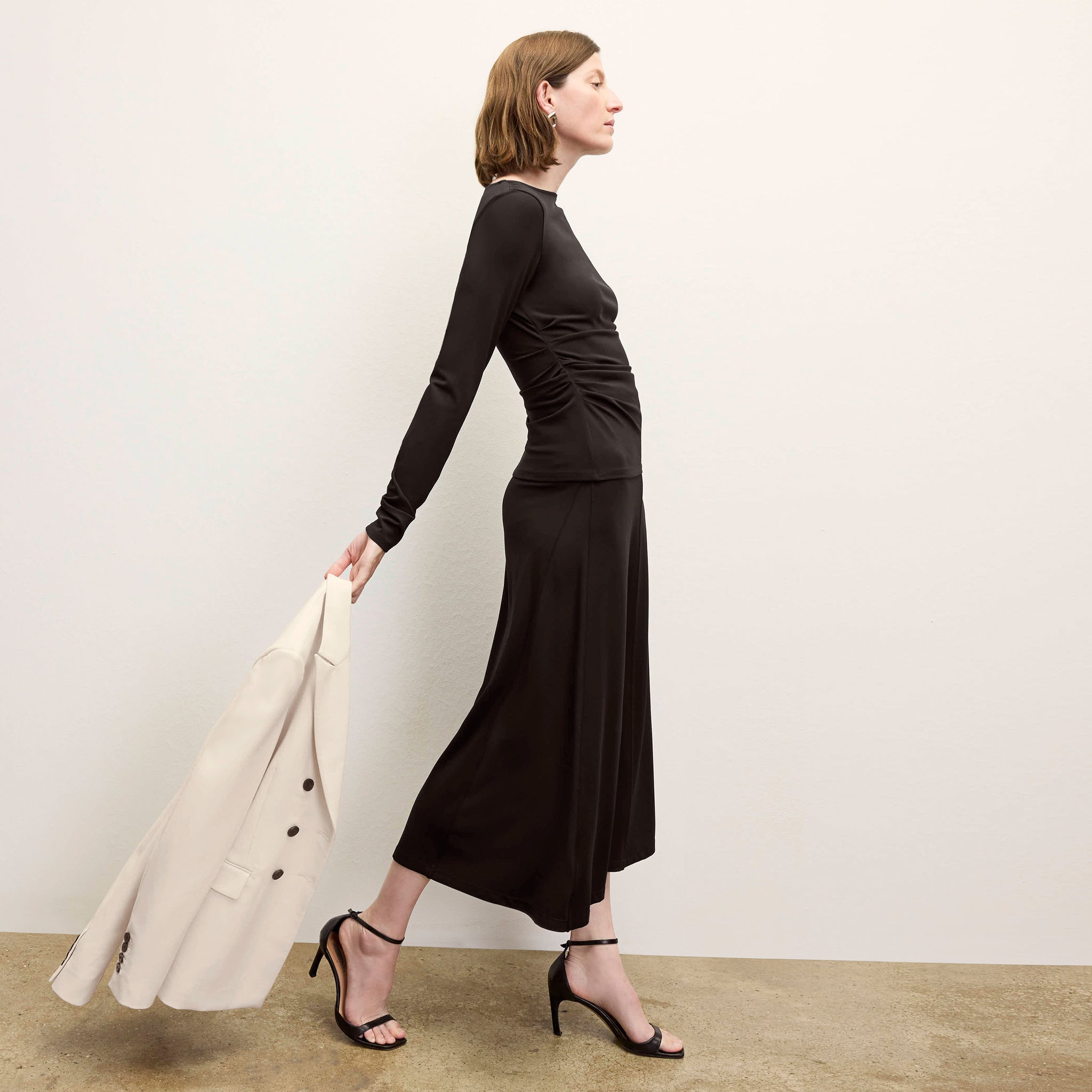 side image of a woman wearing the percy top in black
