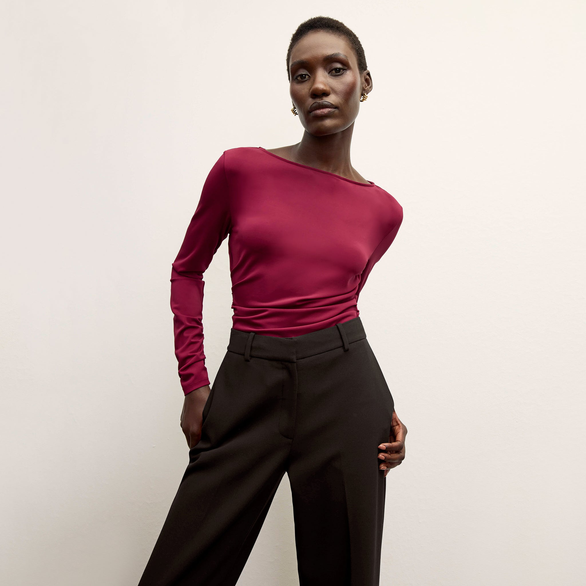 front image of a woman wearing the percy top in grenache 