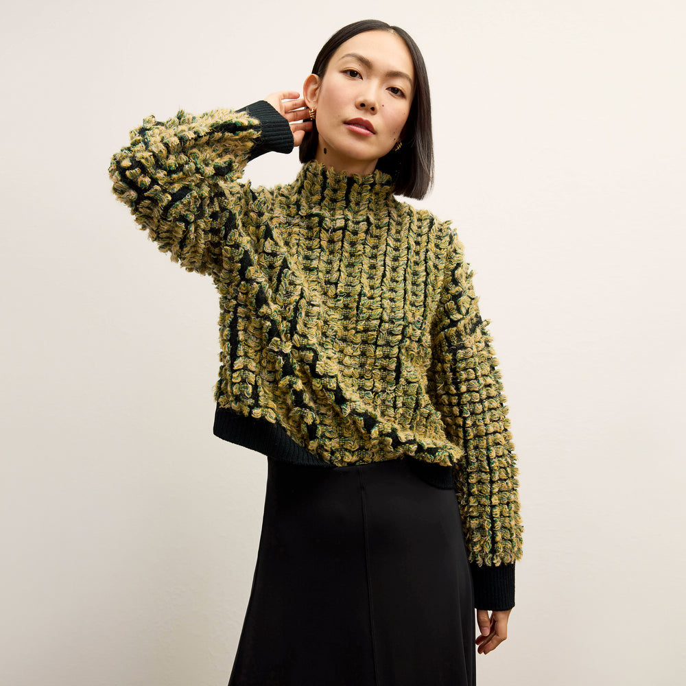 front image of a woman wearing the Rajni Sweater in multi