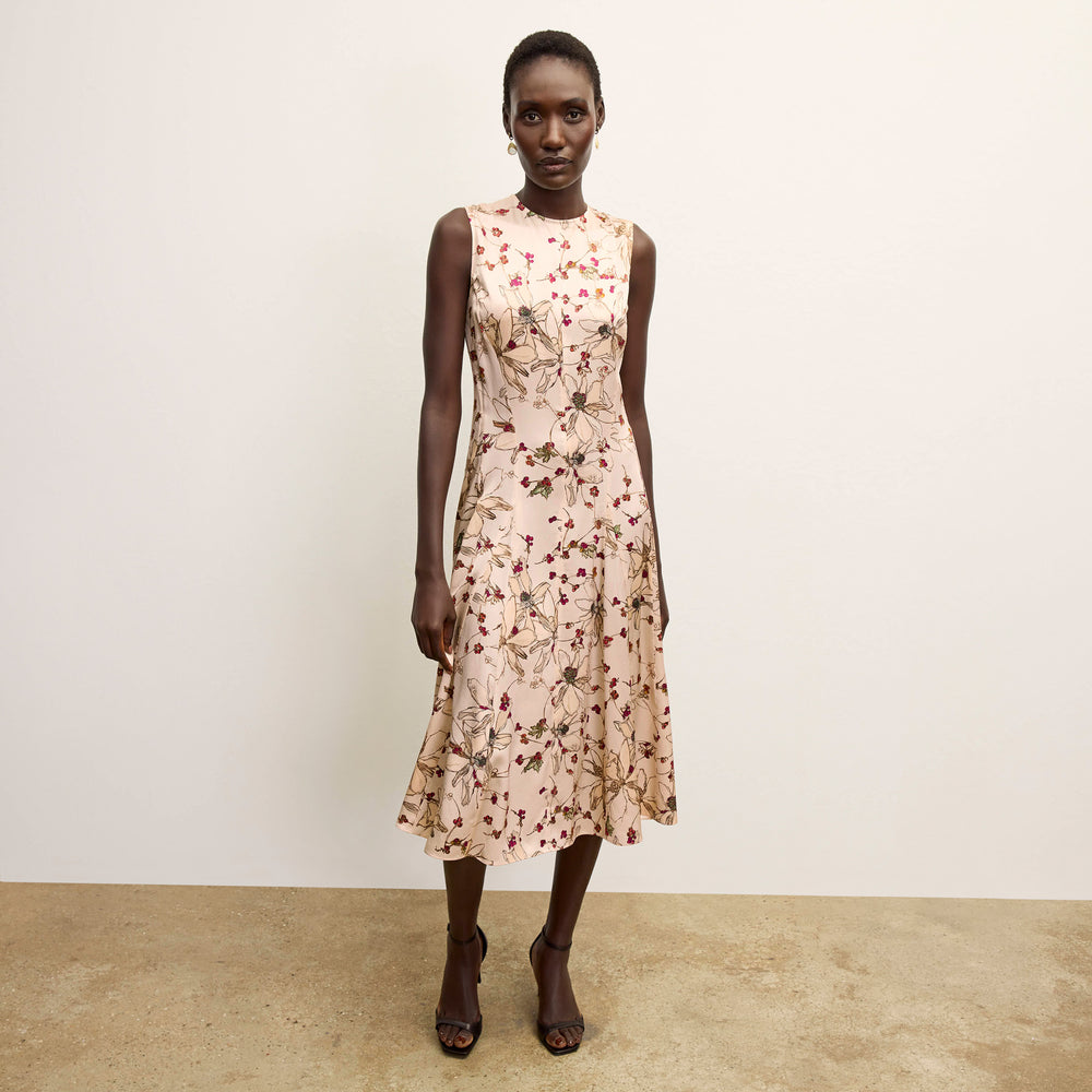 front image of a woman wearing the nyla dress in botanical print