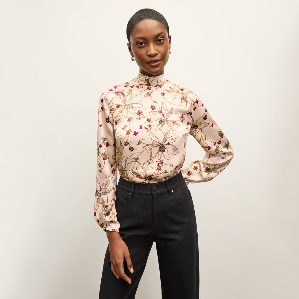 front image of a woman wearing the sohee top in botanical print