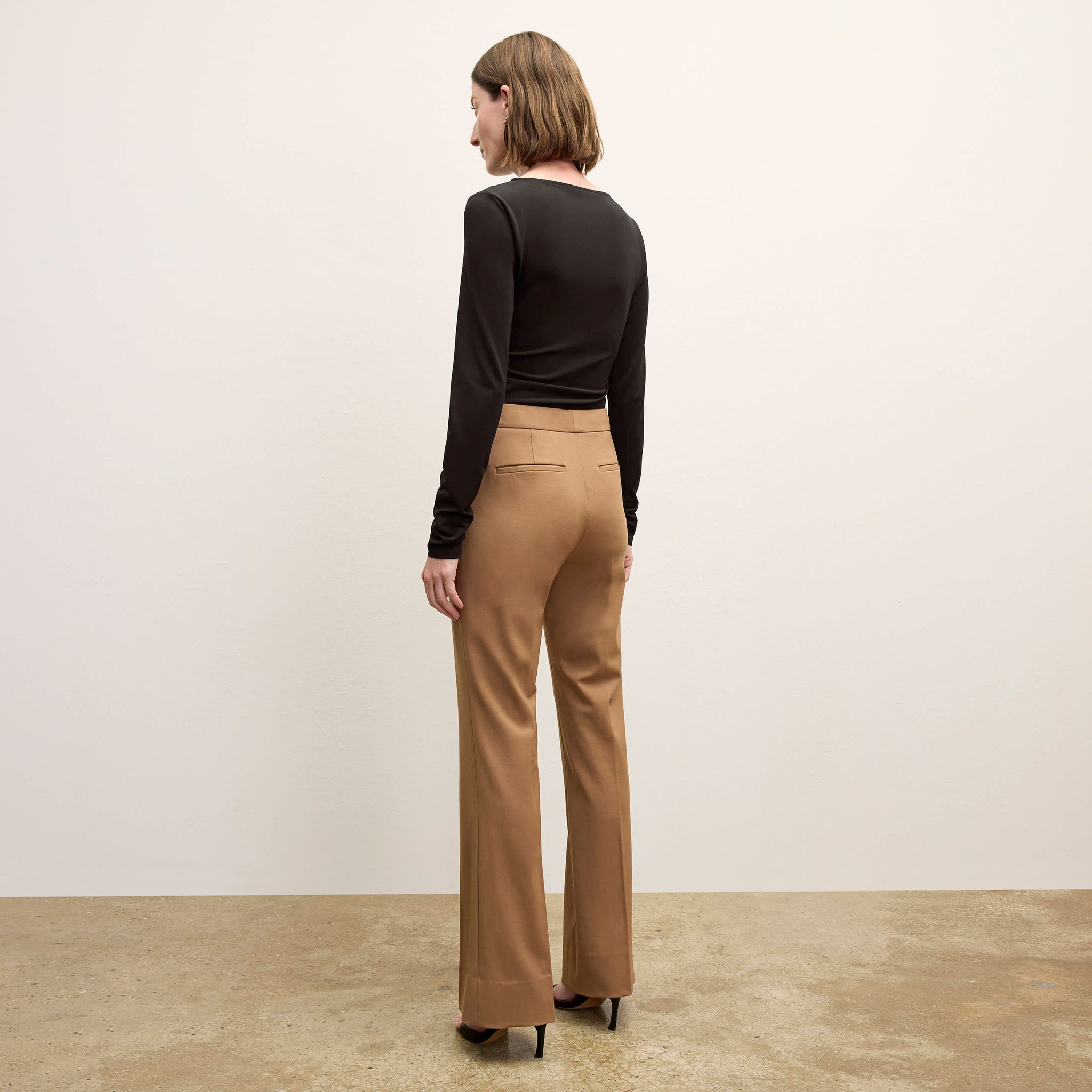 back image of a woman wearing the percy top in black