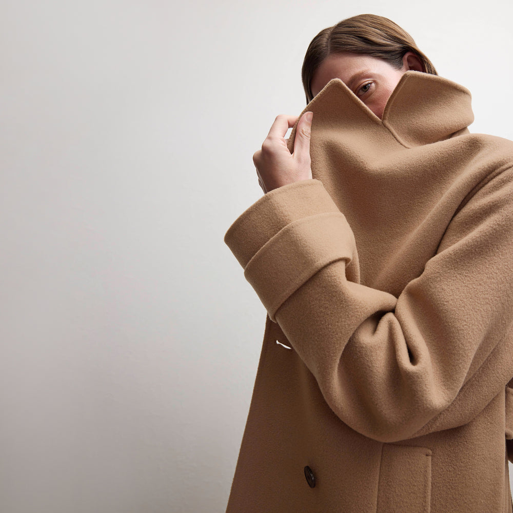 front image of a woman wearing the viola coat in camel