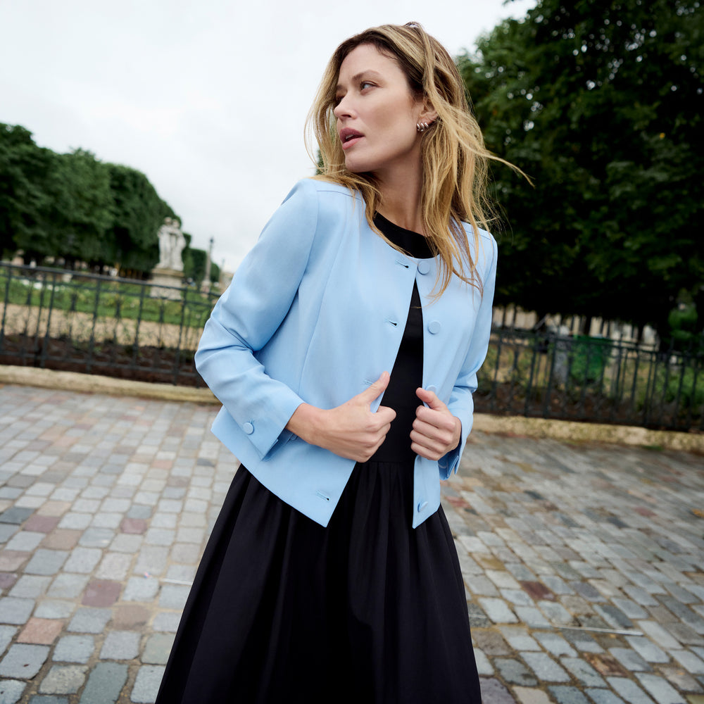 Woman wearing a sleeveless black maxi dress