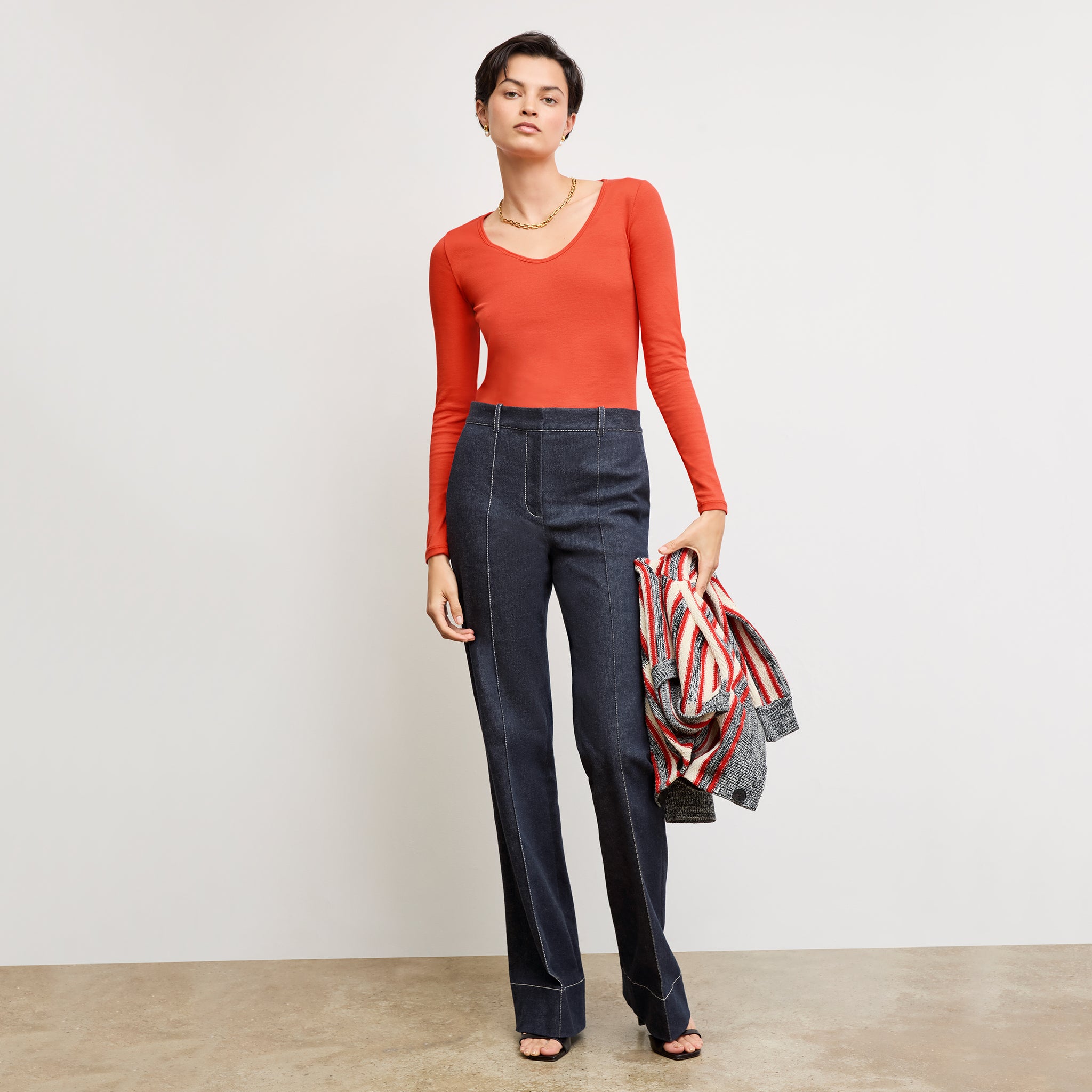front image of a woman wearing the rowe pant in midnight wash