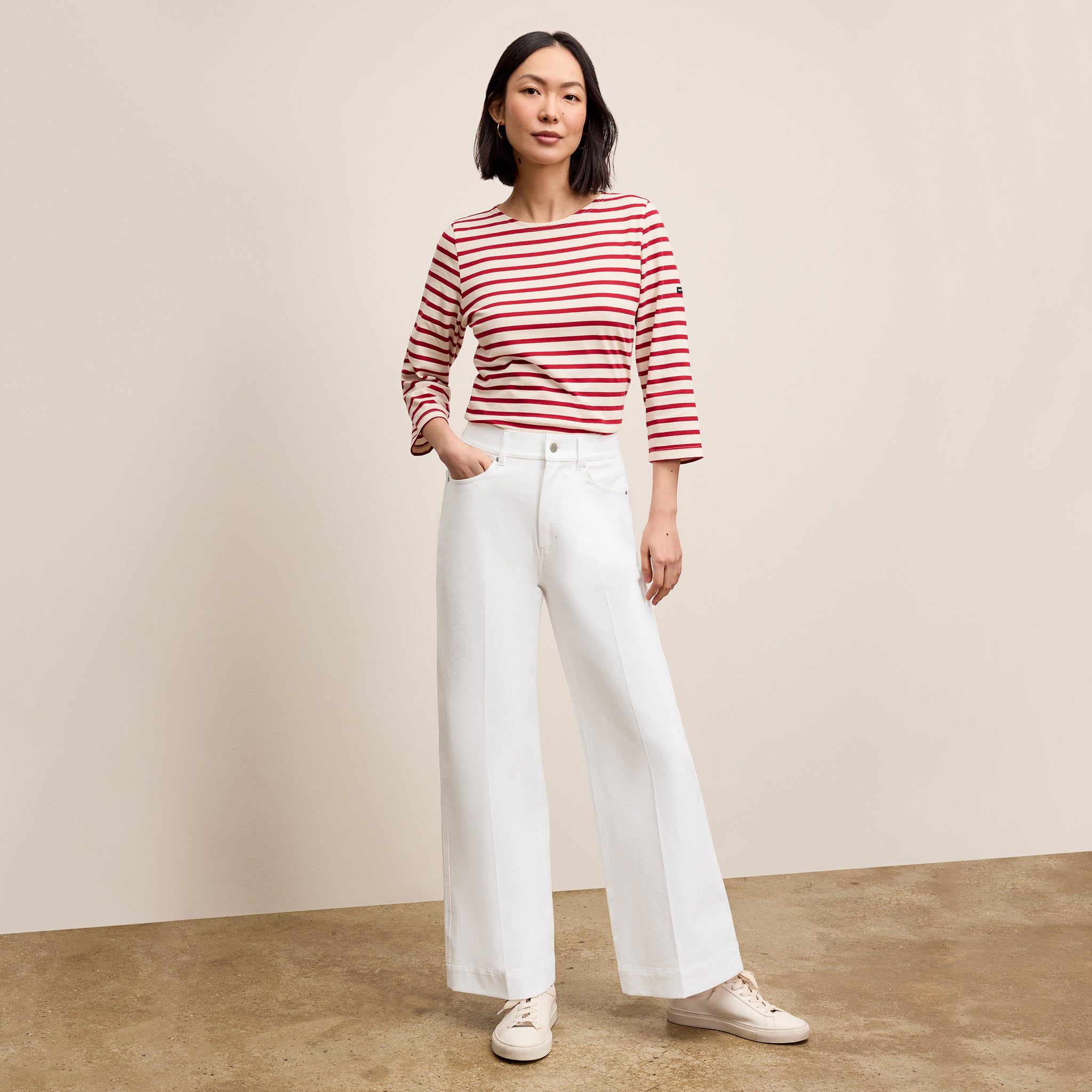 front image of a woman wearing the milo jeans in white