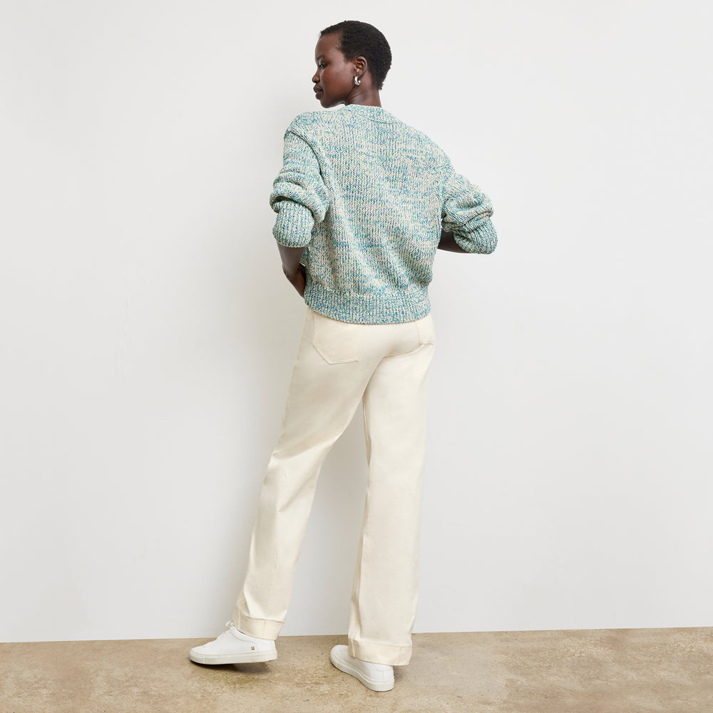 back image of a woman wearing the maura sweater in multi