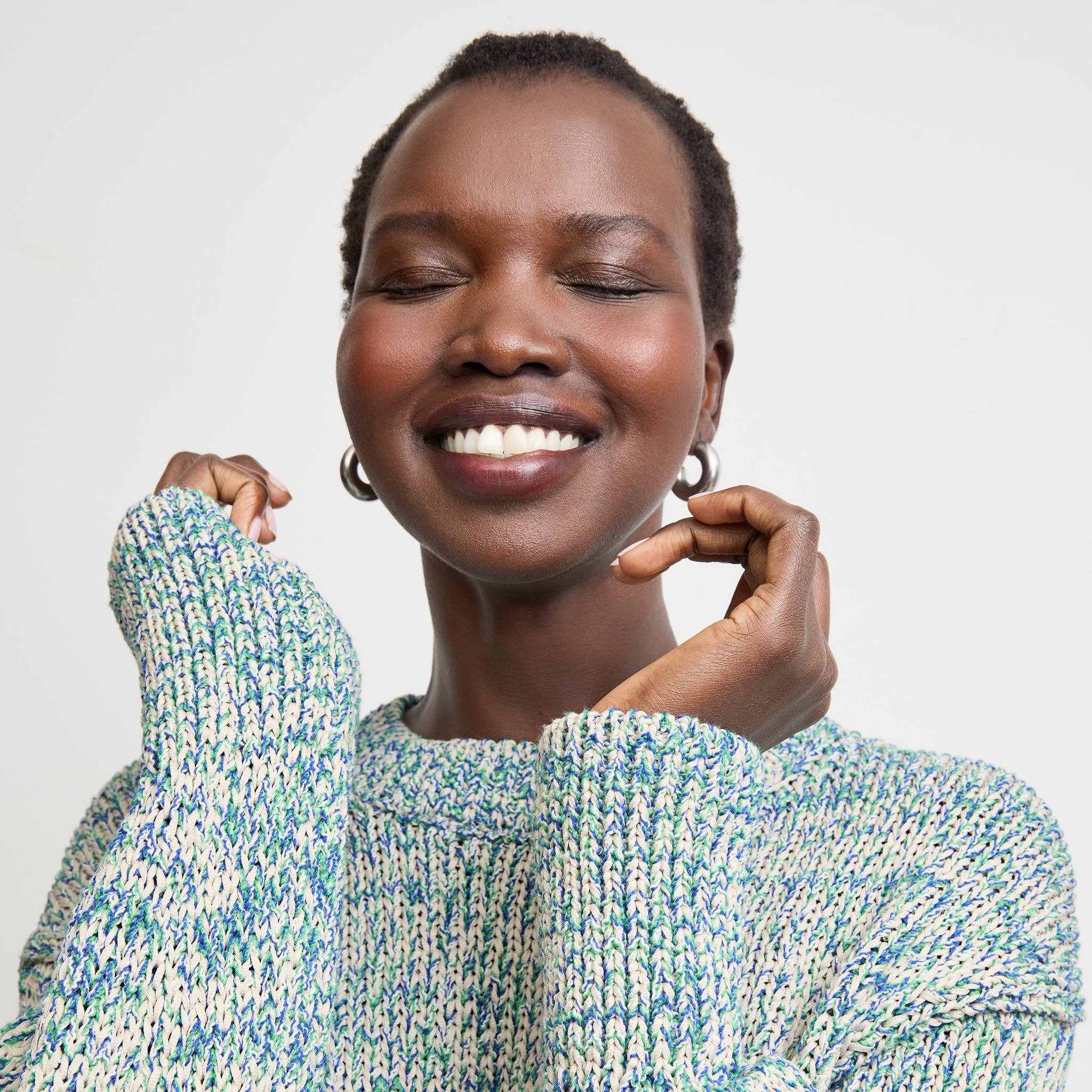 front image of a woman wearing the maura sweater in multi 