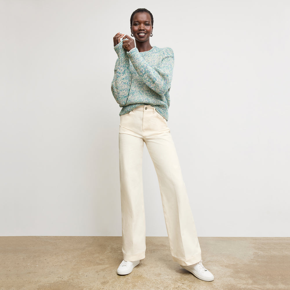 front image of a woman wearing the maura sweater in multi