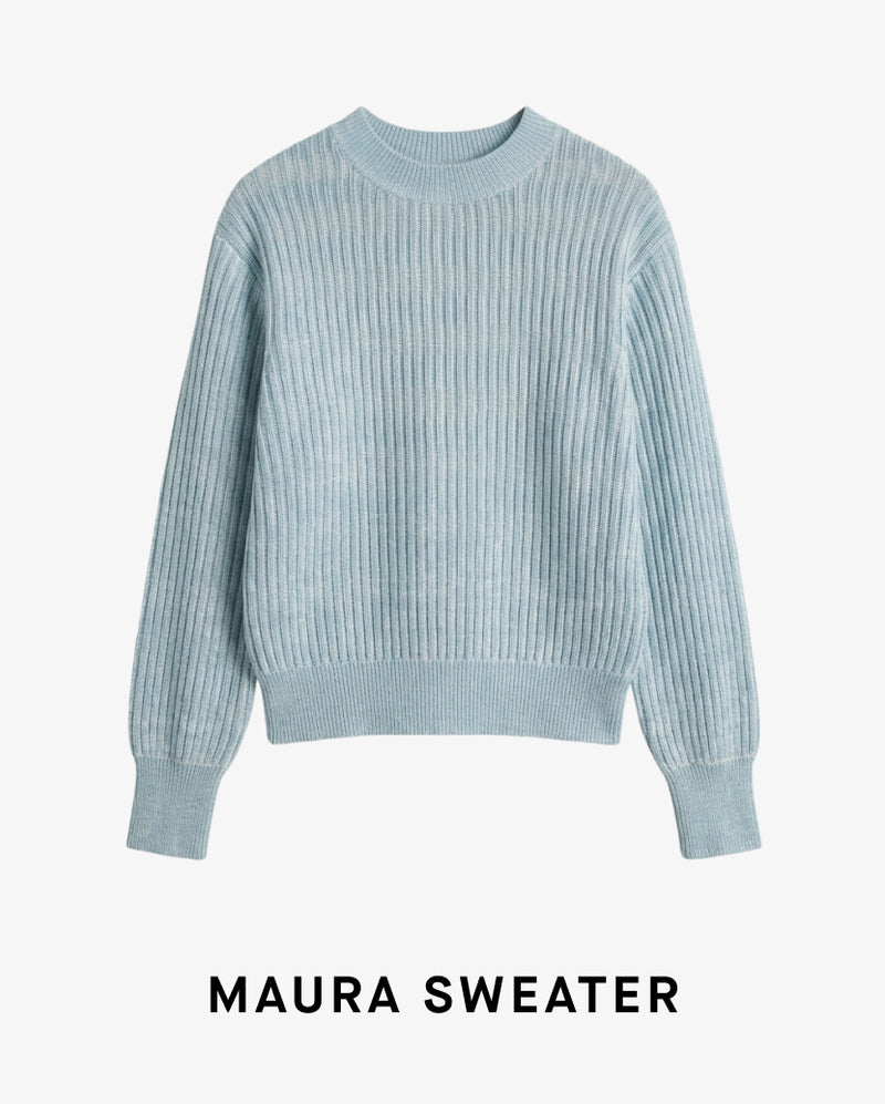 Light blue ribbed sweater on a white background with 'MAURA SWEATER' text.