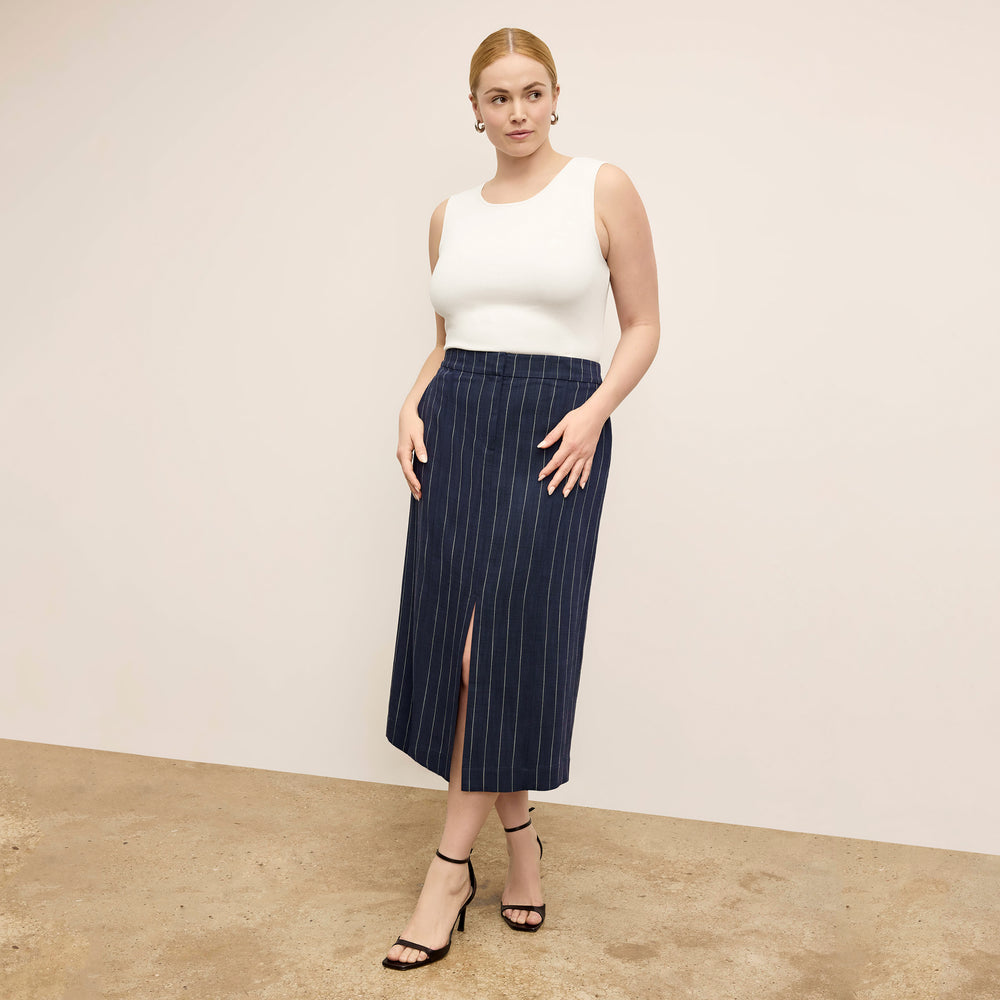 Front image of a woman wearing Meghan1.0Skirt_StripedPortoWeave_Navy-Ivory