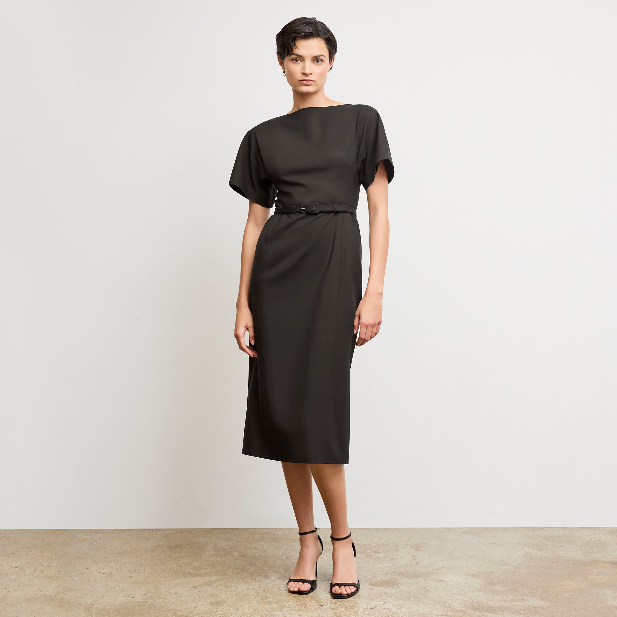 front image of a woman wearing the meredith dress in black
