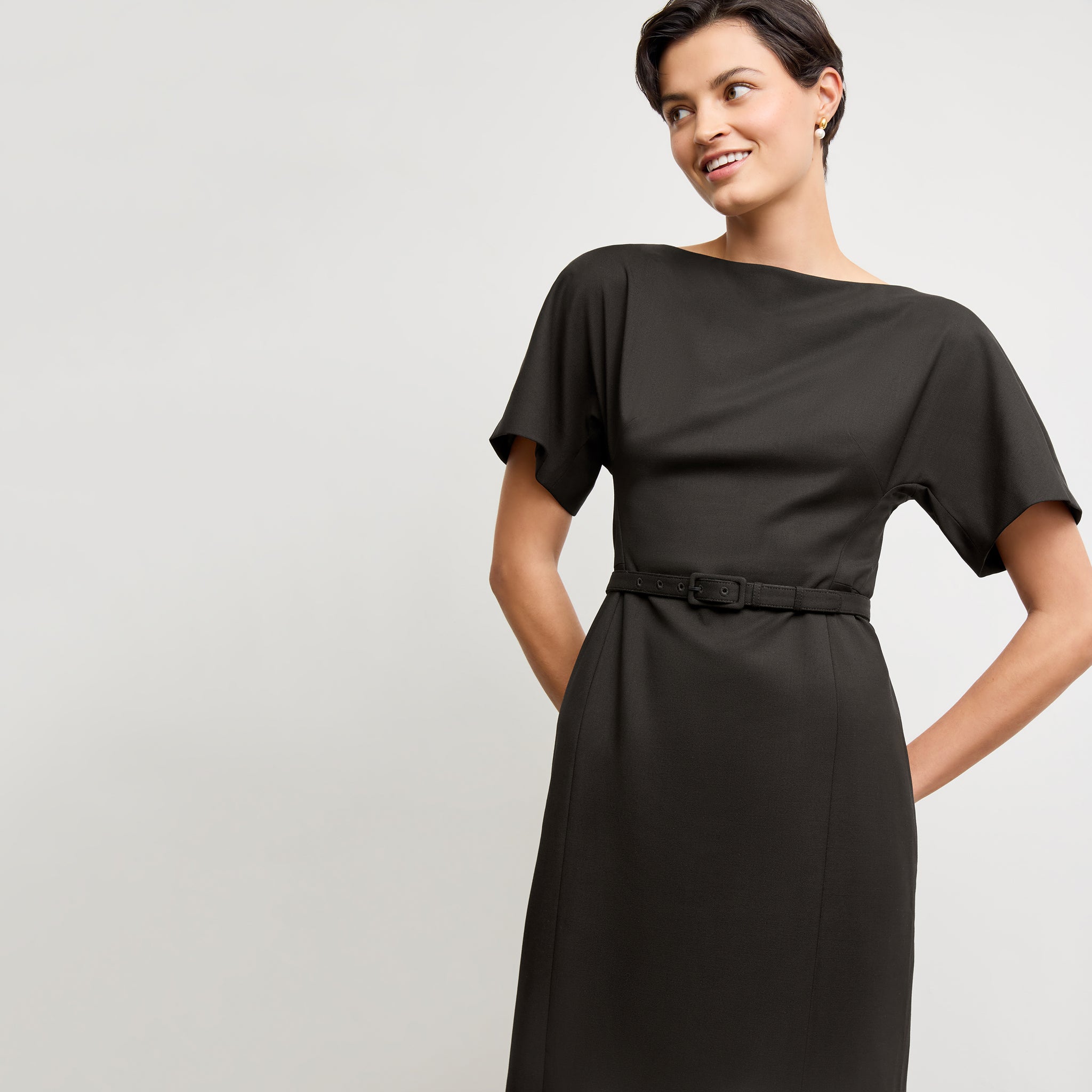 front image of a woman wearing the meredith dress in black