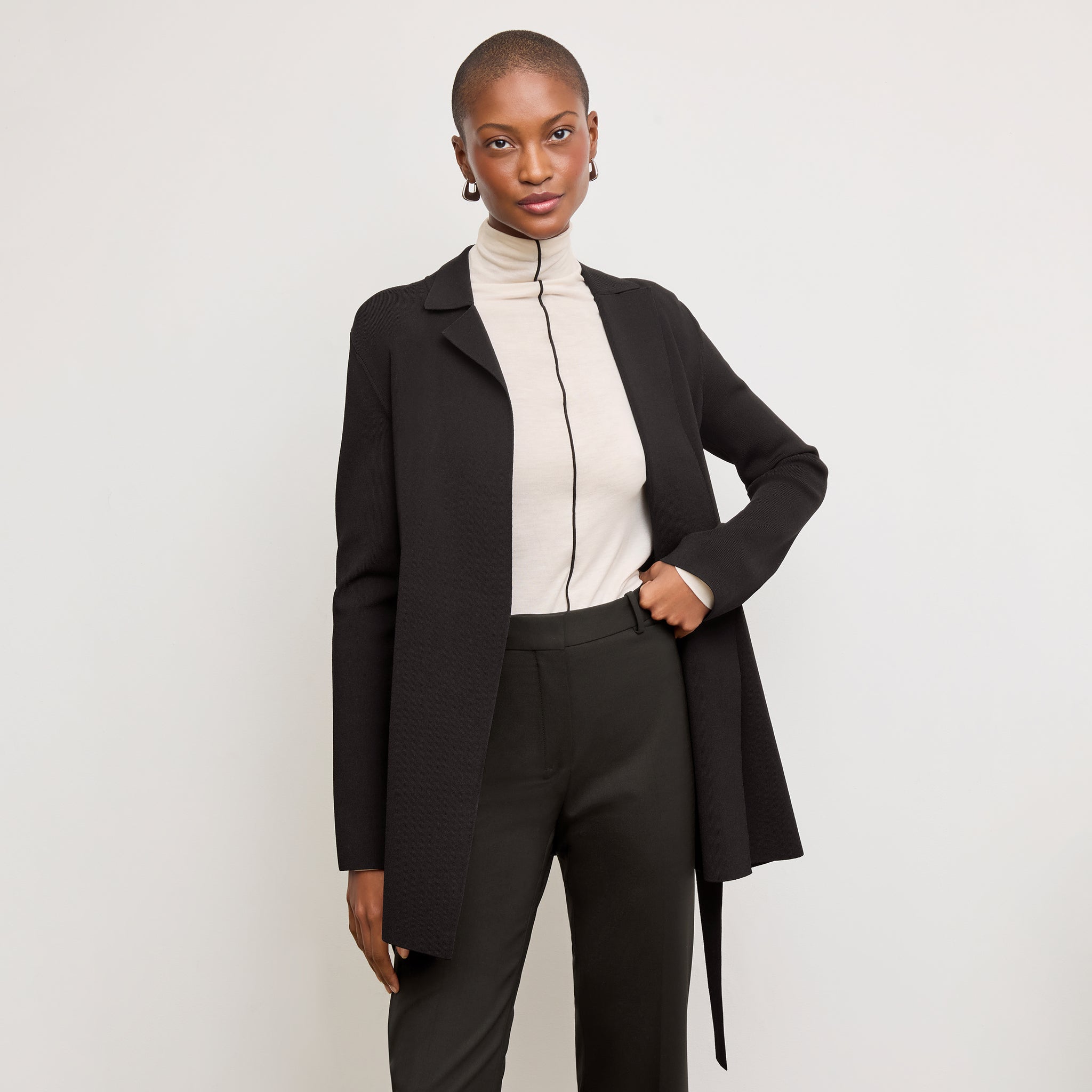 Front image of a woman standing wearing the Merritt jardigan in Black 