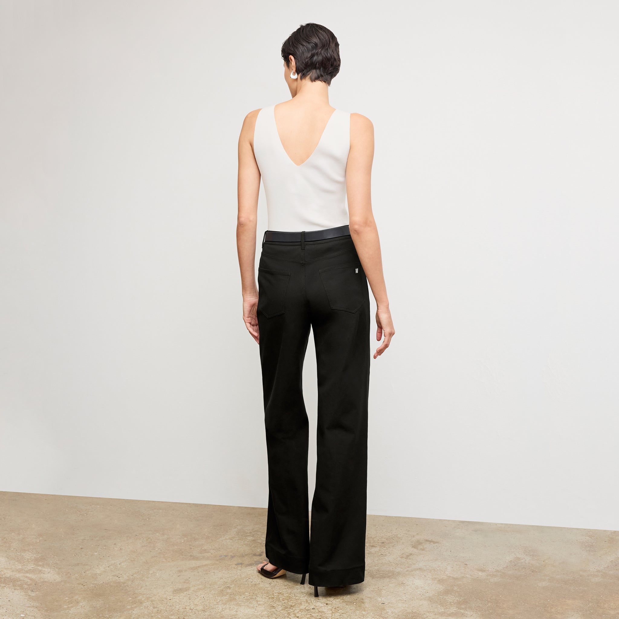 Back image of a woman wearing the Milo Jean in Black