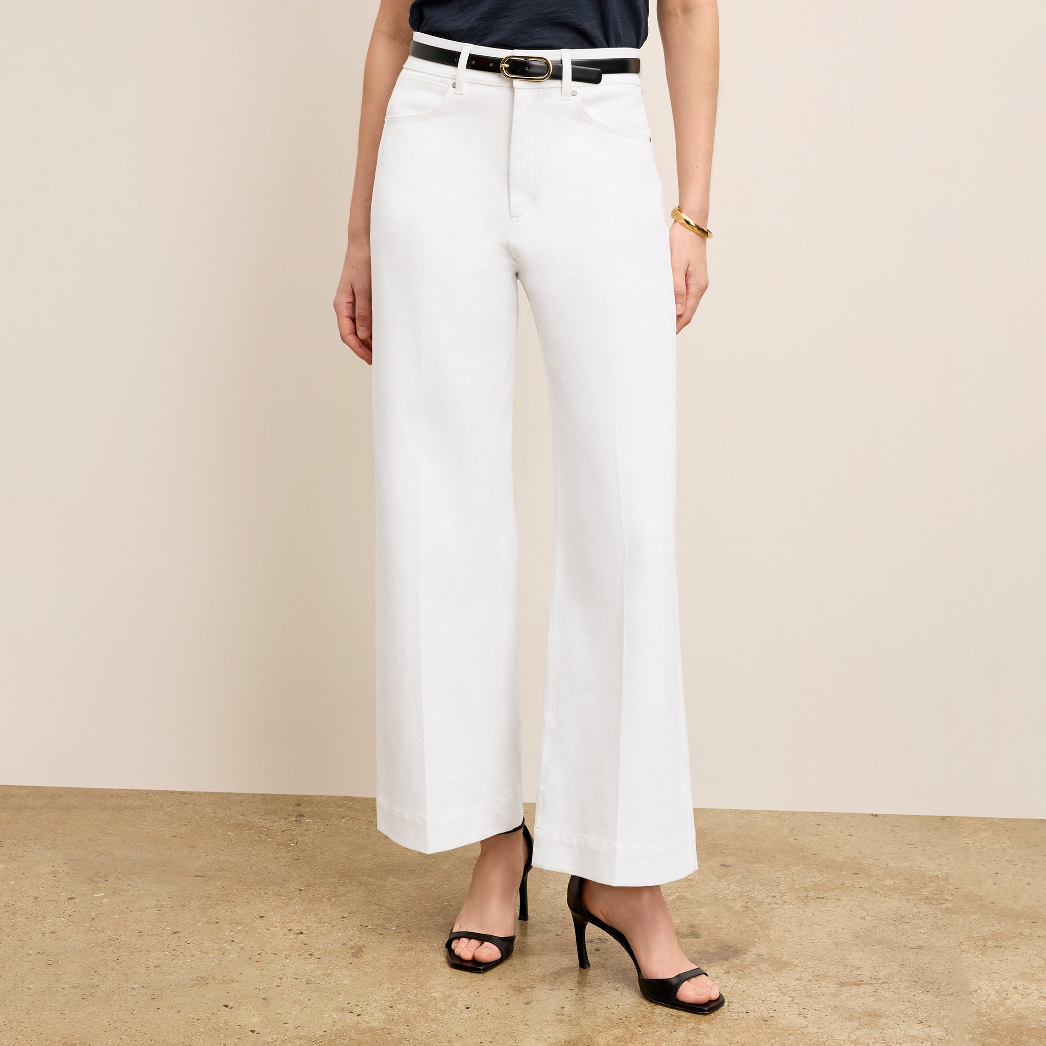 front image of a woman wearing the milo jeans in white 