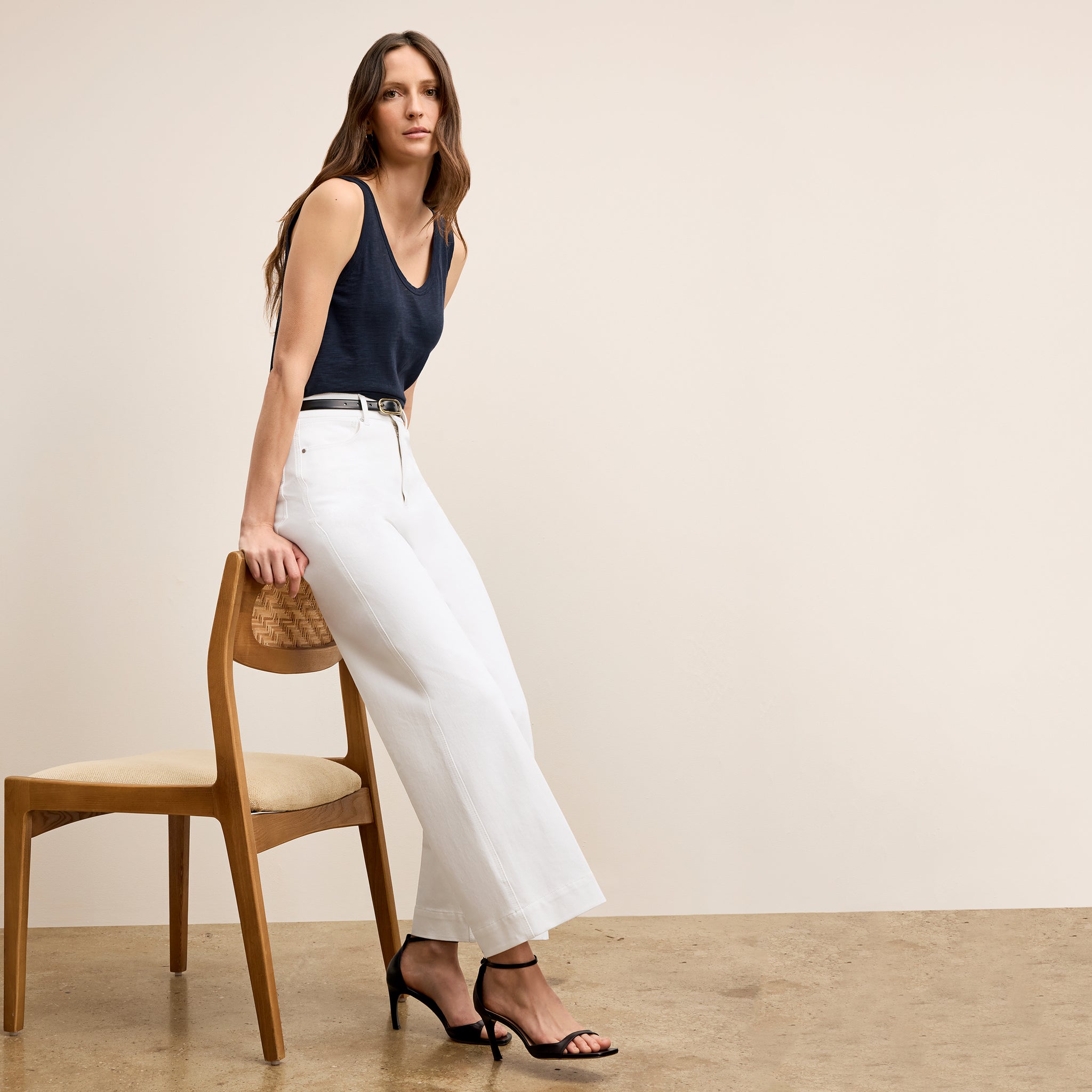 front image of a woman wearing the milo jeans in white