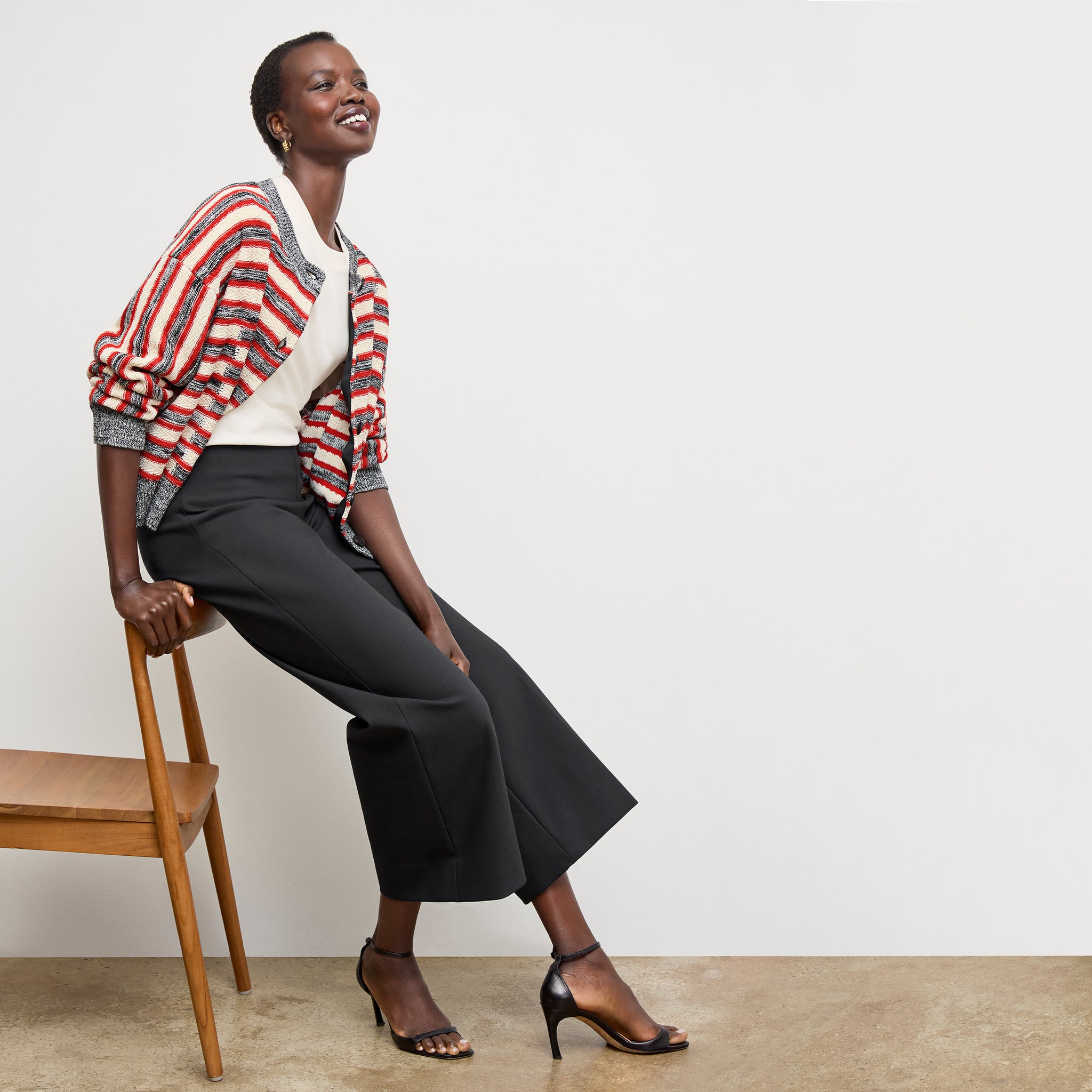 Front image of a woman wearing the adler pant in black