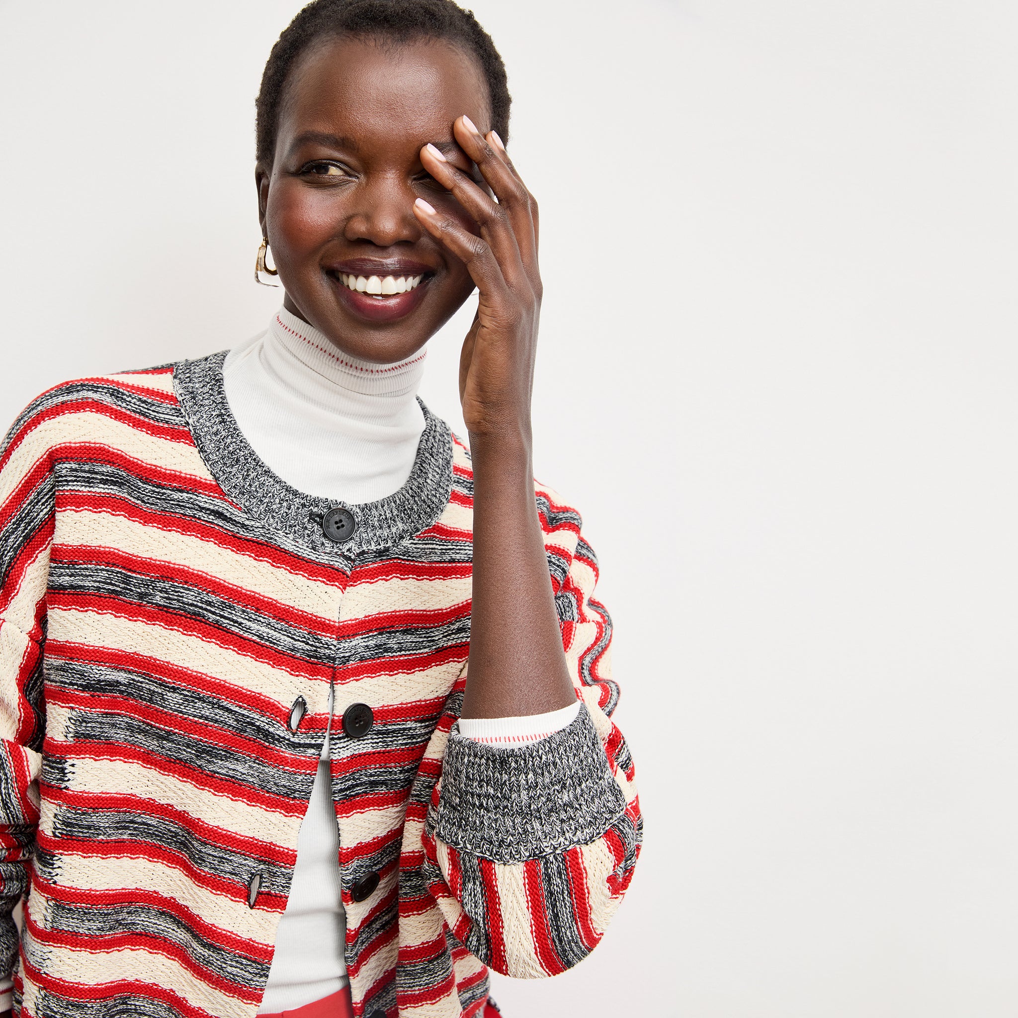 front image of a woman wearing the axam top in white