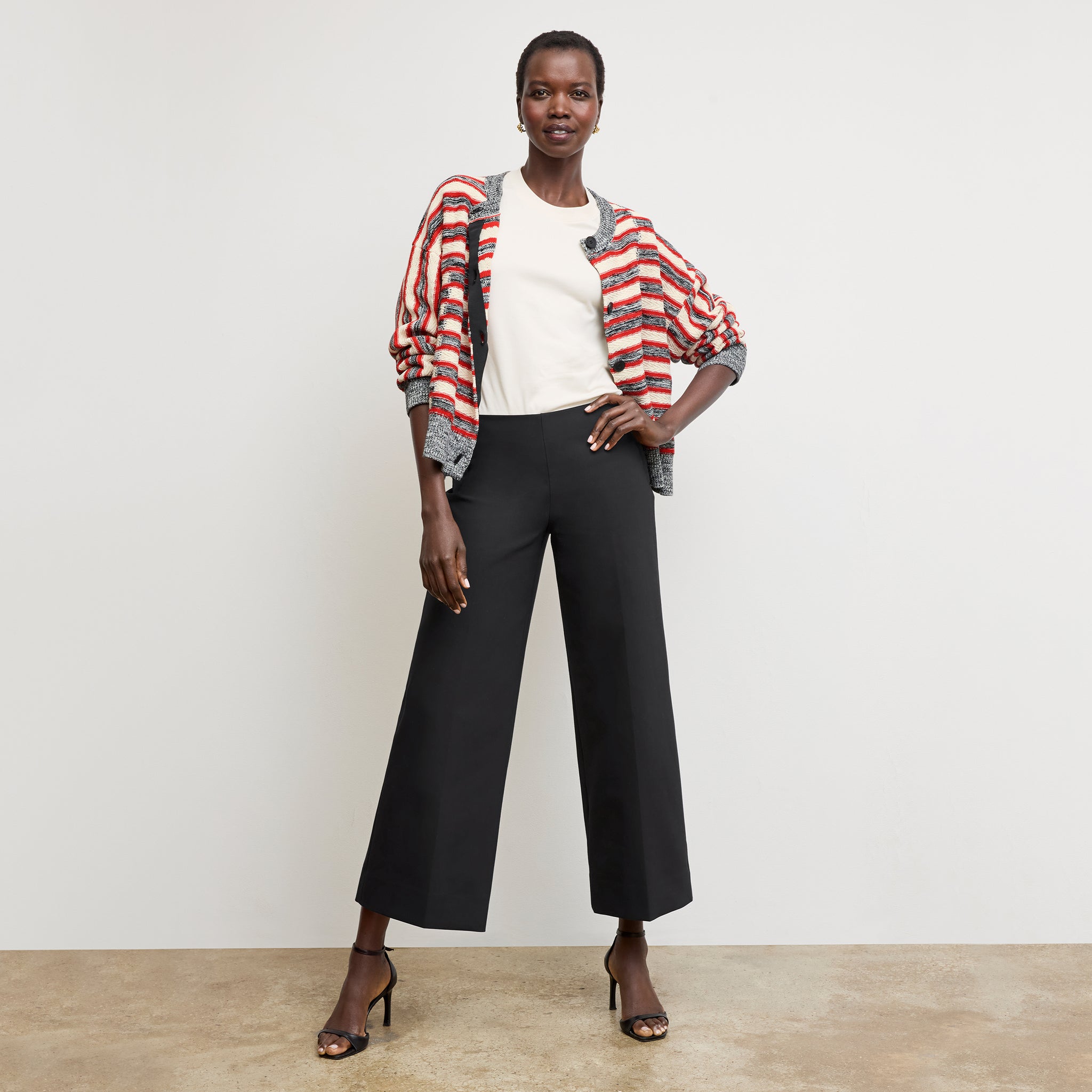 Front image of a woman wearing the adler pant in black 