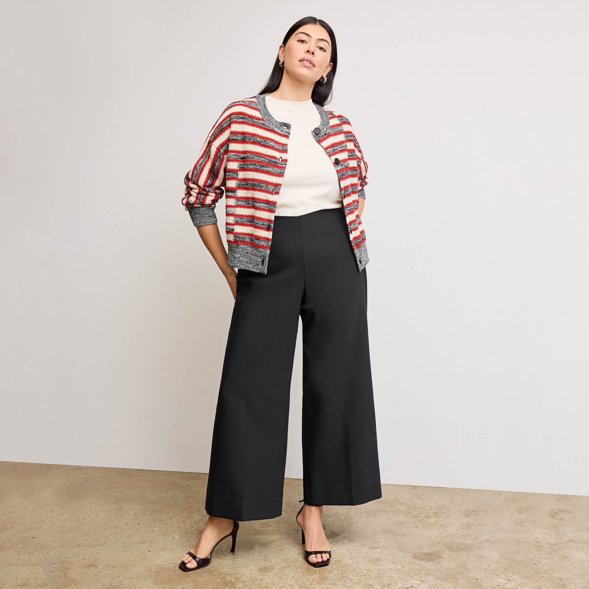 Front image of a woman wearing the adler pant in black